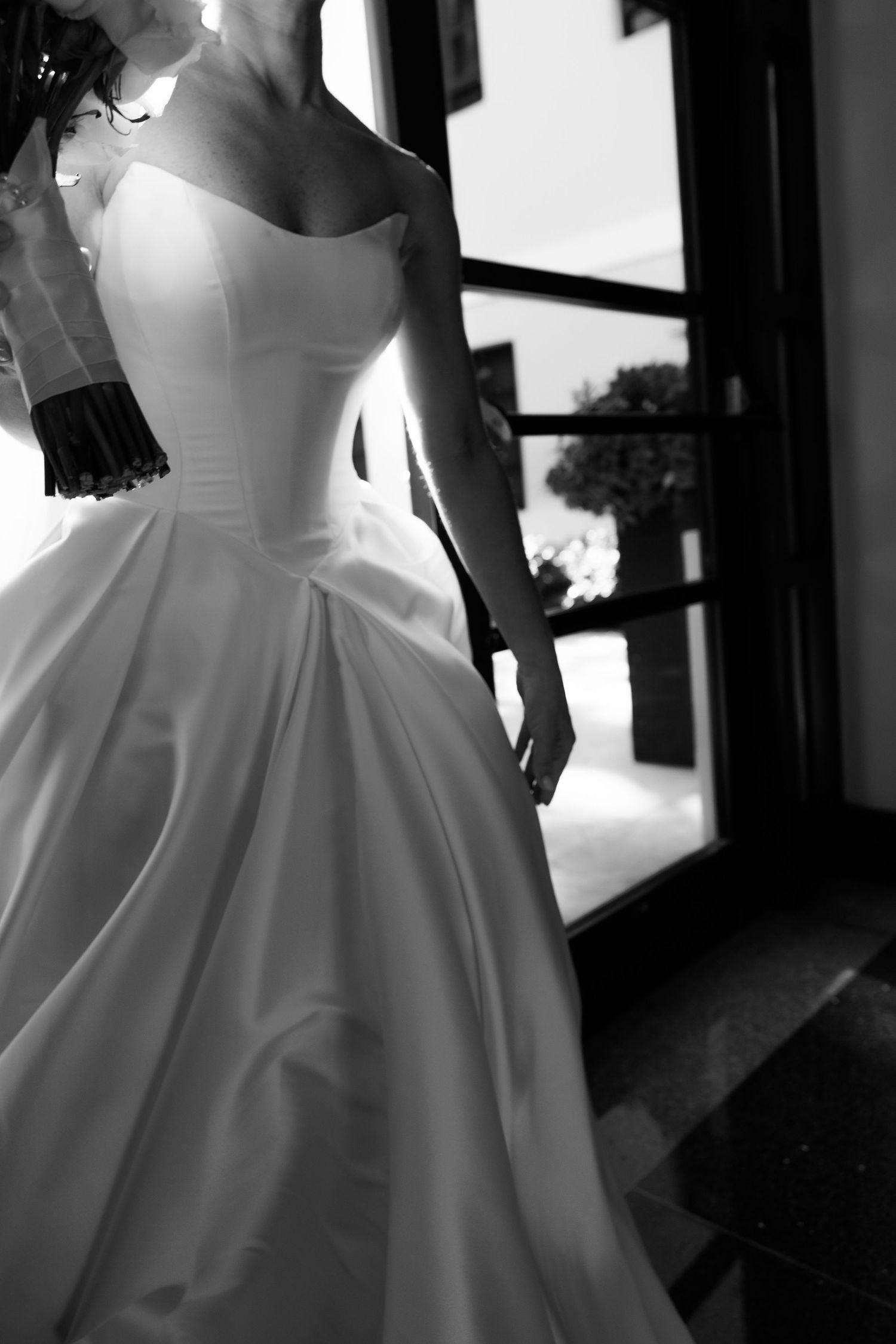 Black and white detail shot of elegant ballgown wedding dress.