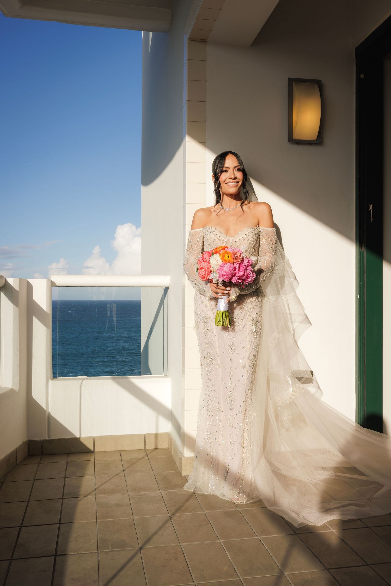 Wedding photography sequence showing bride in lace dress against ocean backdrop on balcony.