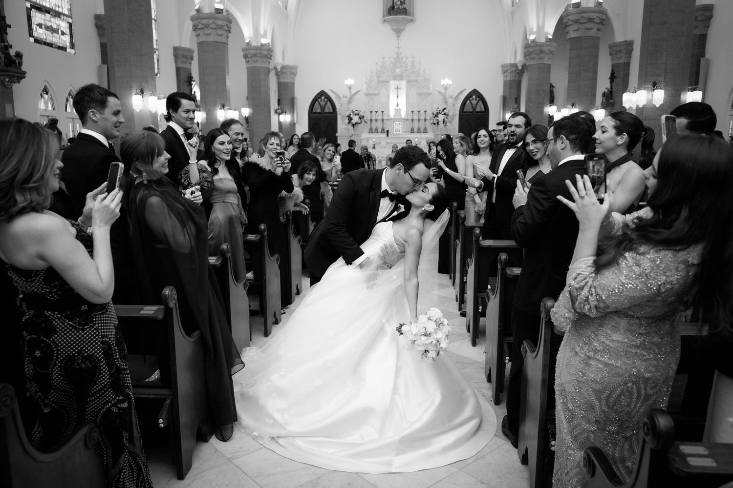 A series of black and white wedding photos showing a reception celebration with dancing and formal attire.