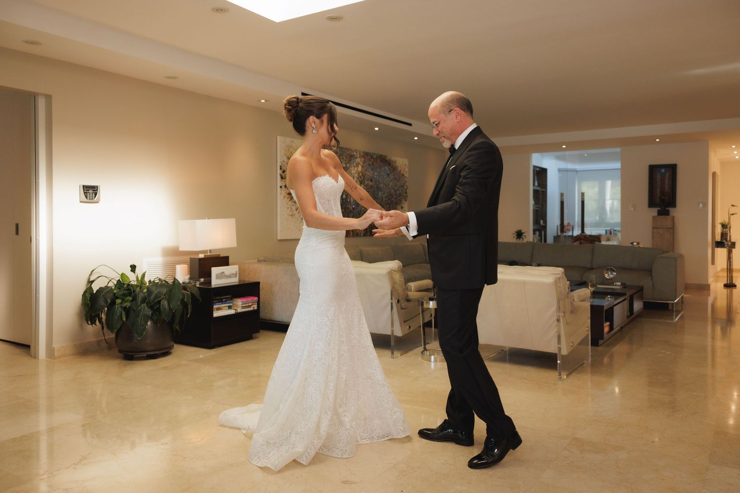 A sequence of wedding dance photos showing a couple practicing their first dance in an elegant hallway.