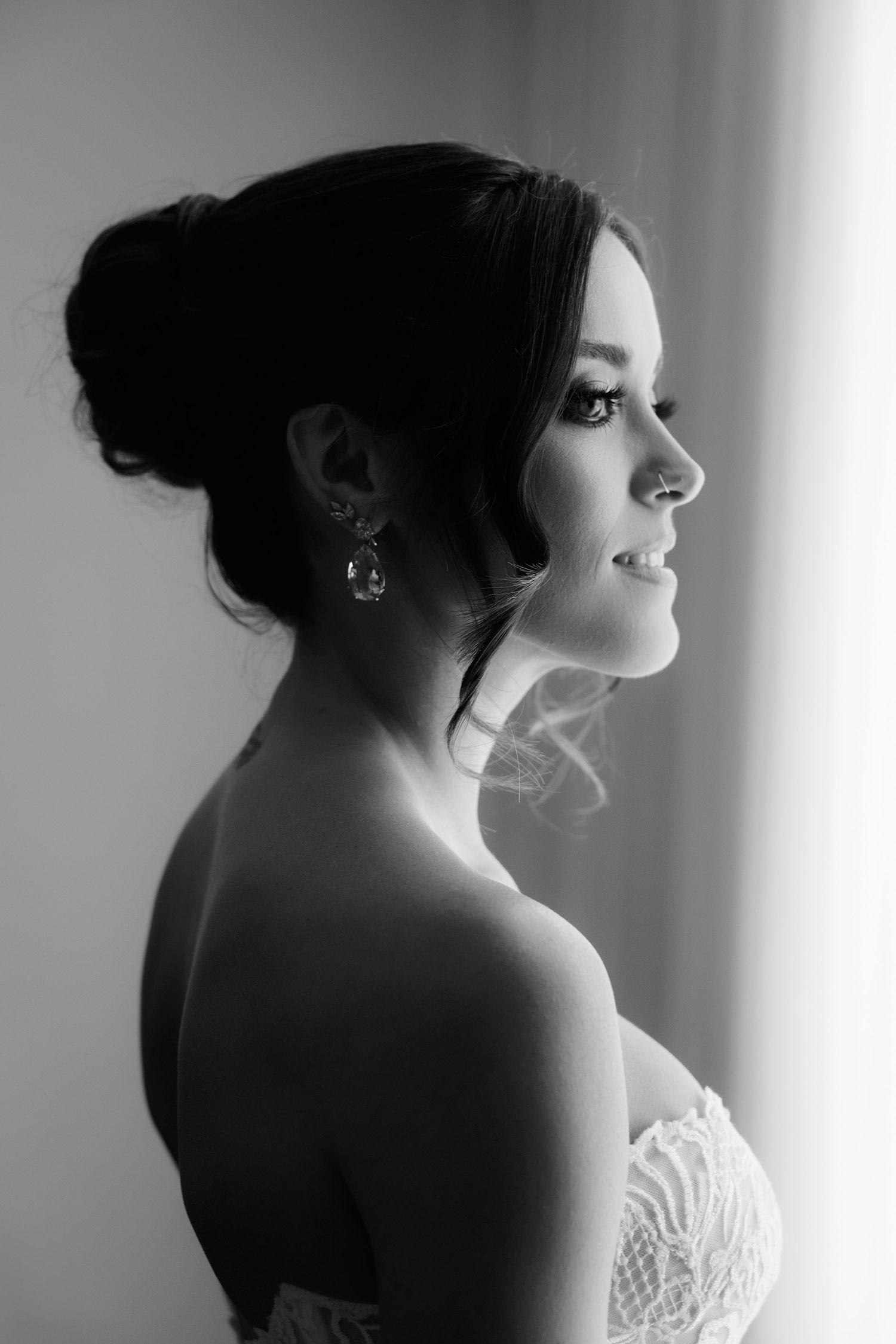 Artistic black and white profile shots capture the elegant silhouette of someone in bridal attire.