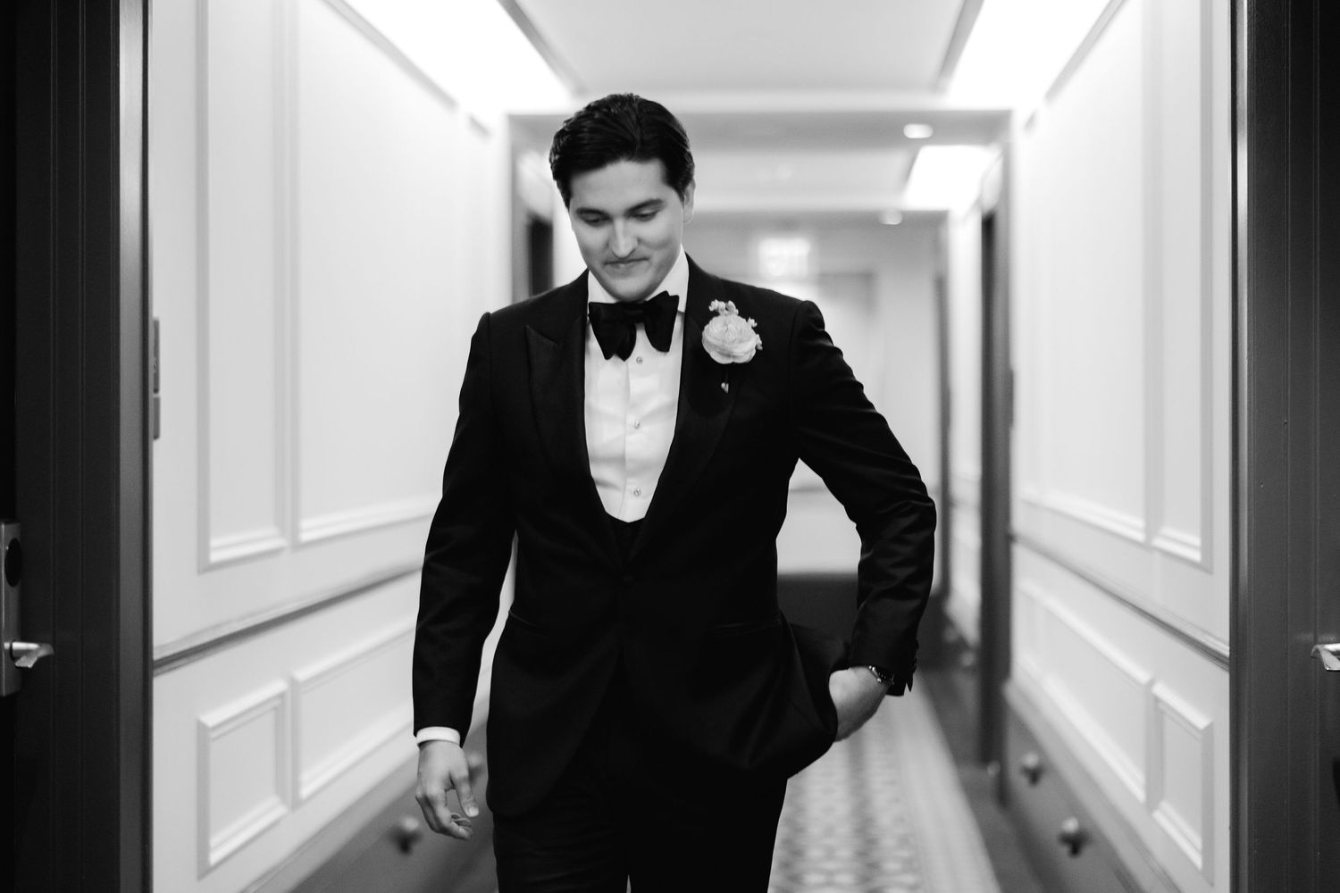 Dark hallway with black and white formal attire.