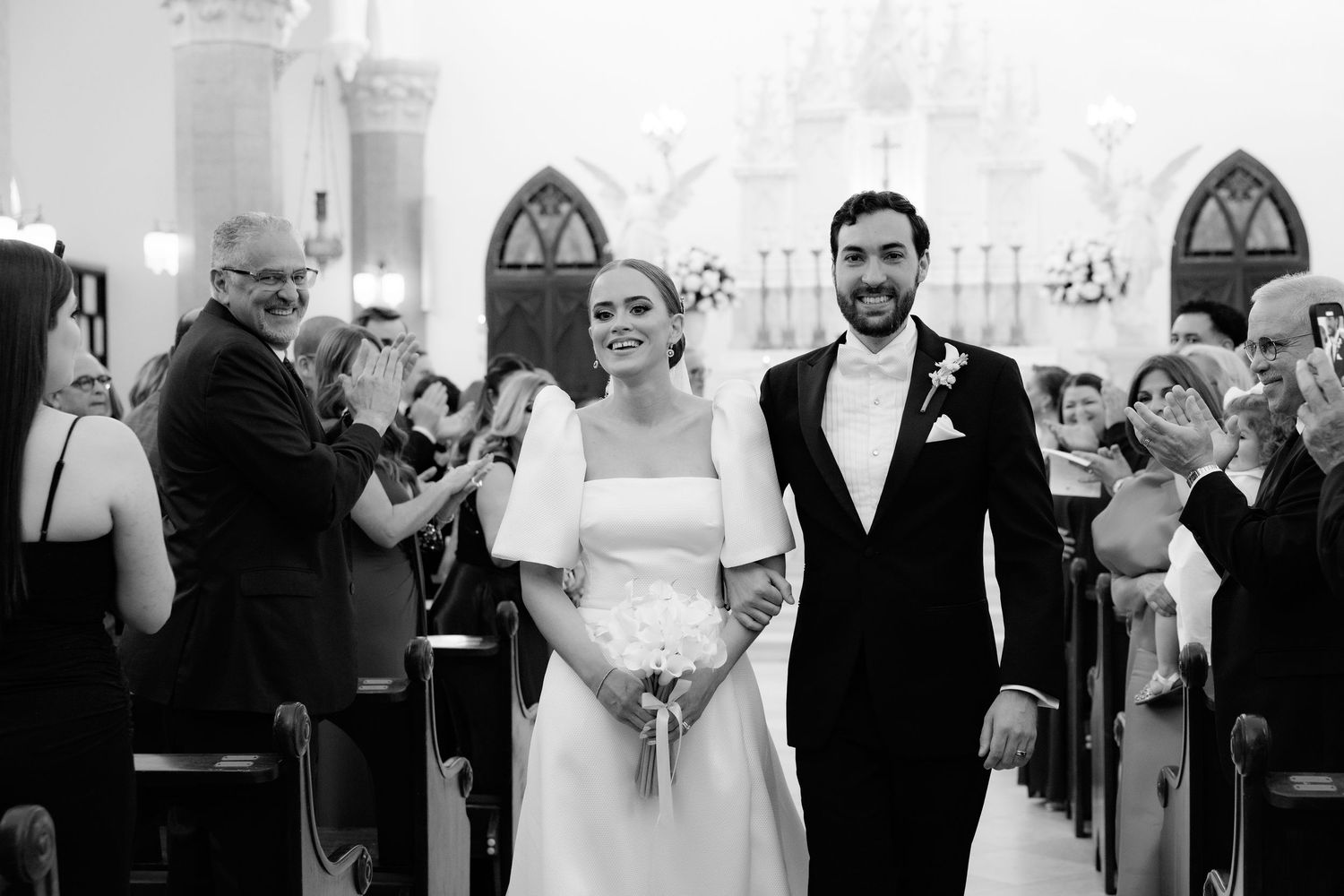 A montage of black and white wedding photography moments showing ceremony and reception celebrations.