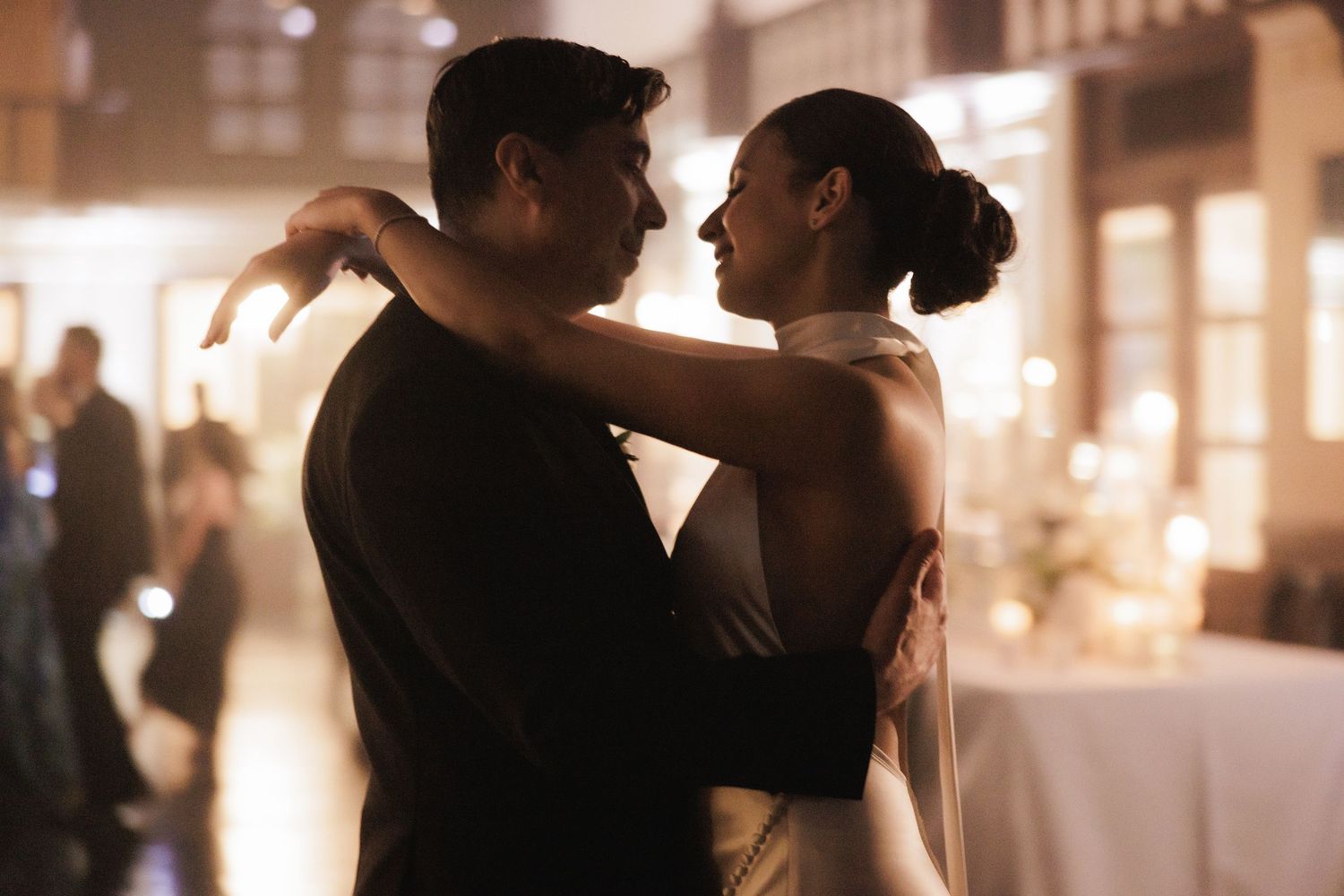 Romantic dance moments captured during evening wedding reception.