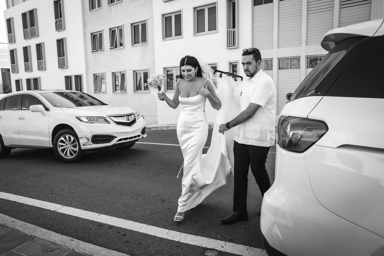 A sequence of candid wedding photos showing playful moments near parked cars.