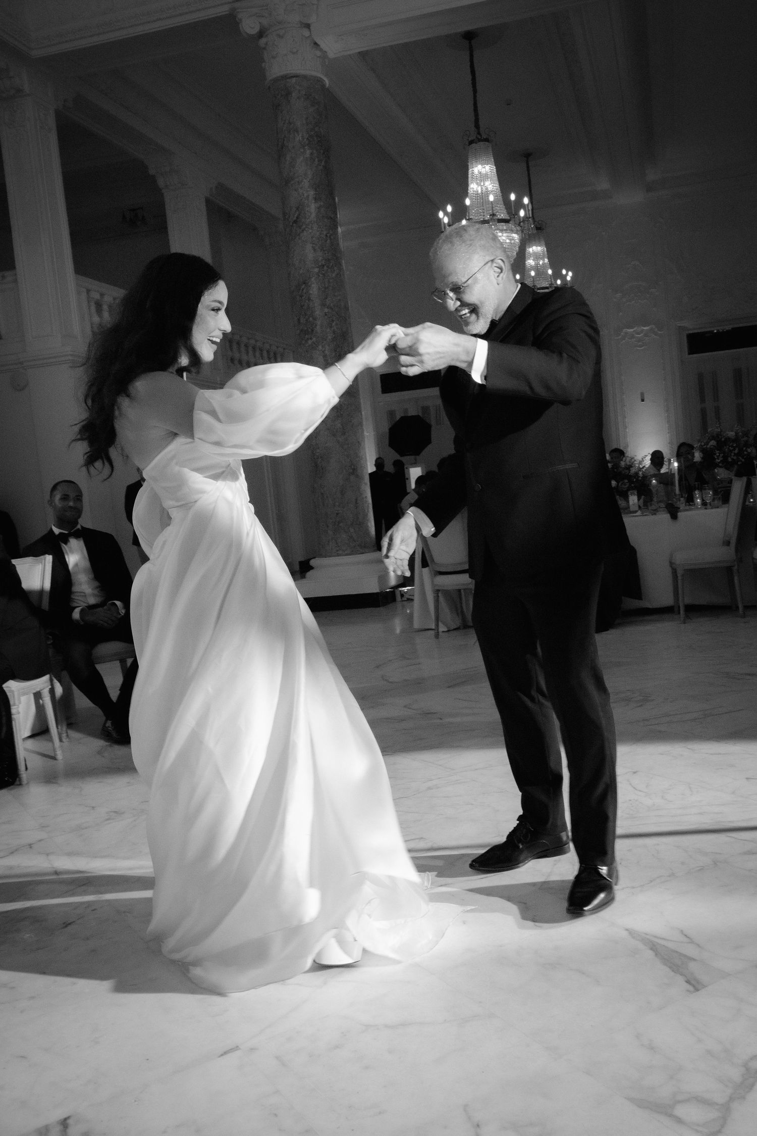 A black and white photo sequence captures a dramatic wedding dance with flowing movements.