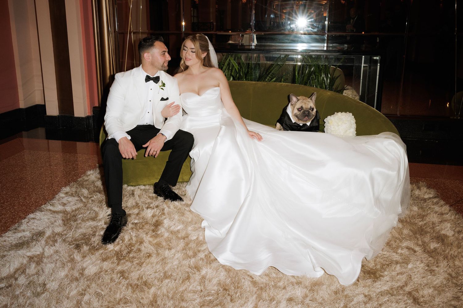Newlyweds share romantic moments in formal attire during their wedding reception photo session.