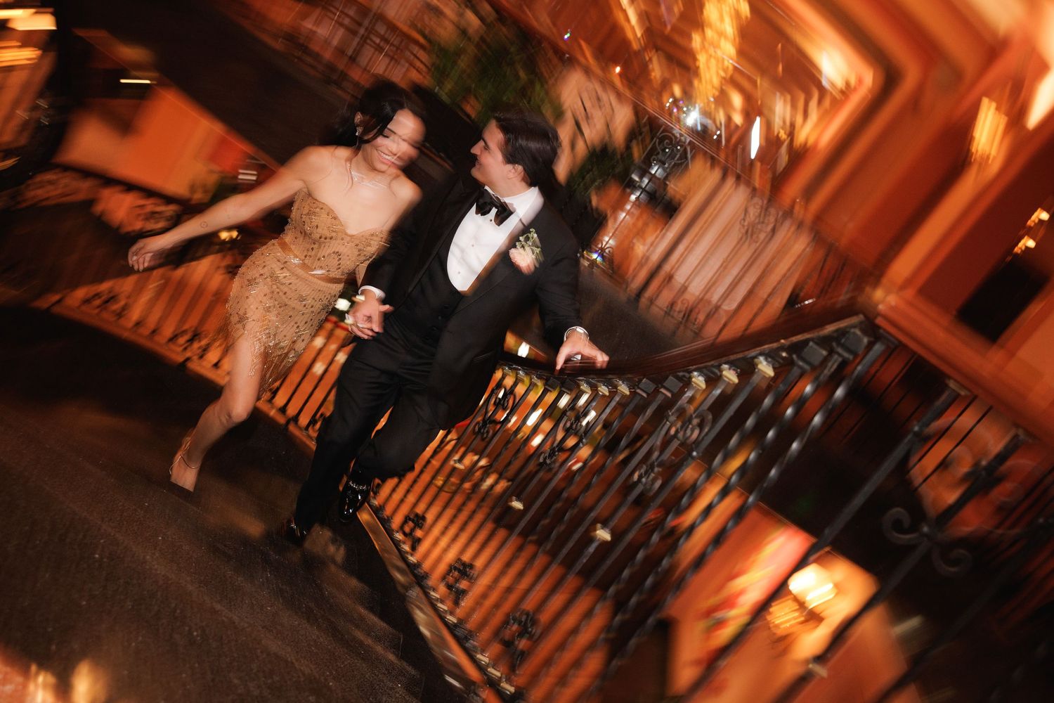 A series of warm-lit dance photos capturing couples twirling and moving together at an elegant evening event.