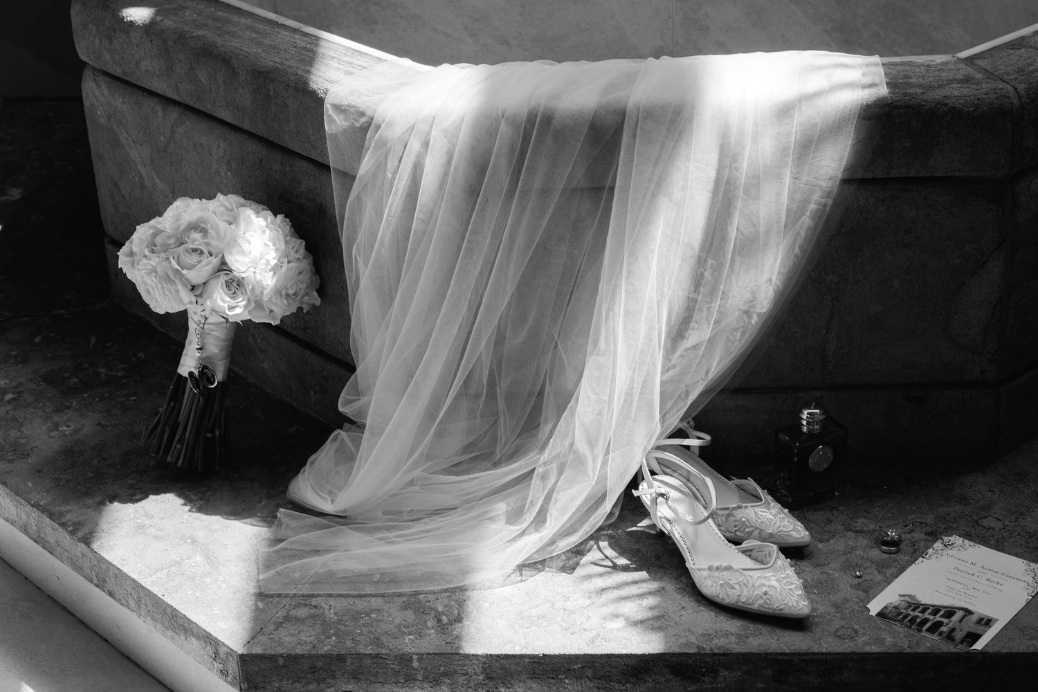 A dreamy black and white series showing flowing white fabric and dress details in soft ethereal lighting.