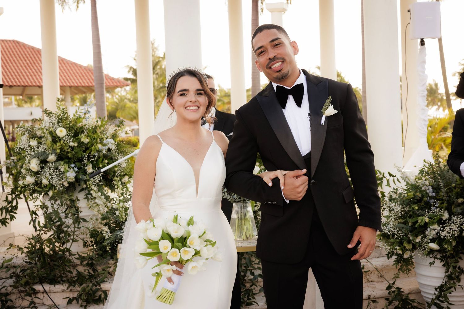 A joyful wedding ceremony moment with the couple laughing together on their special day.