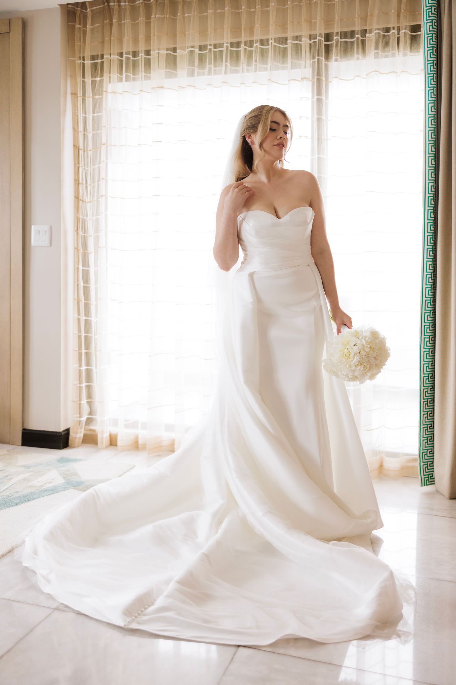 Elegant bridal portraits showing the movement and flow of a classic white wedding dress.