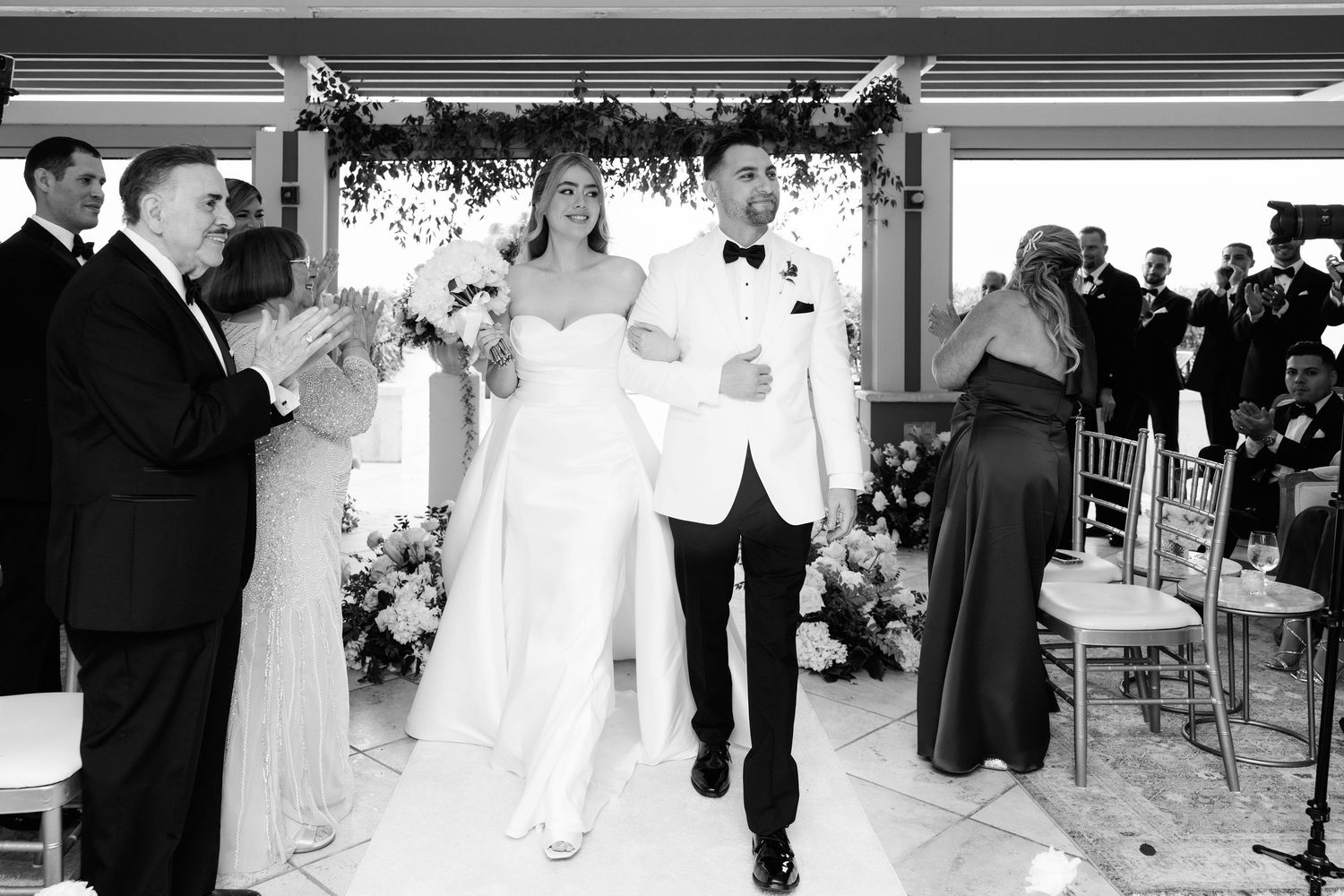 Black and white wedding ceremony photos showing various moments between participants.