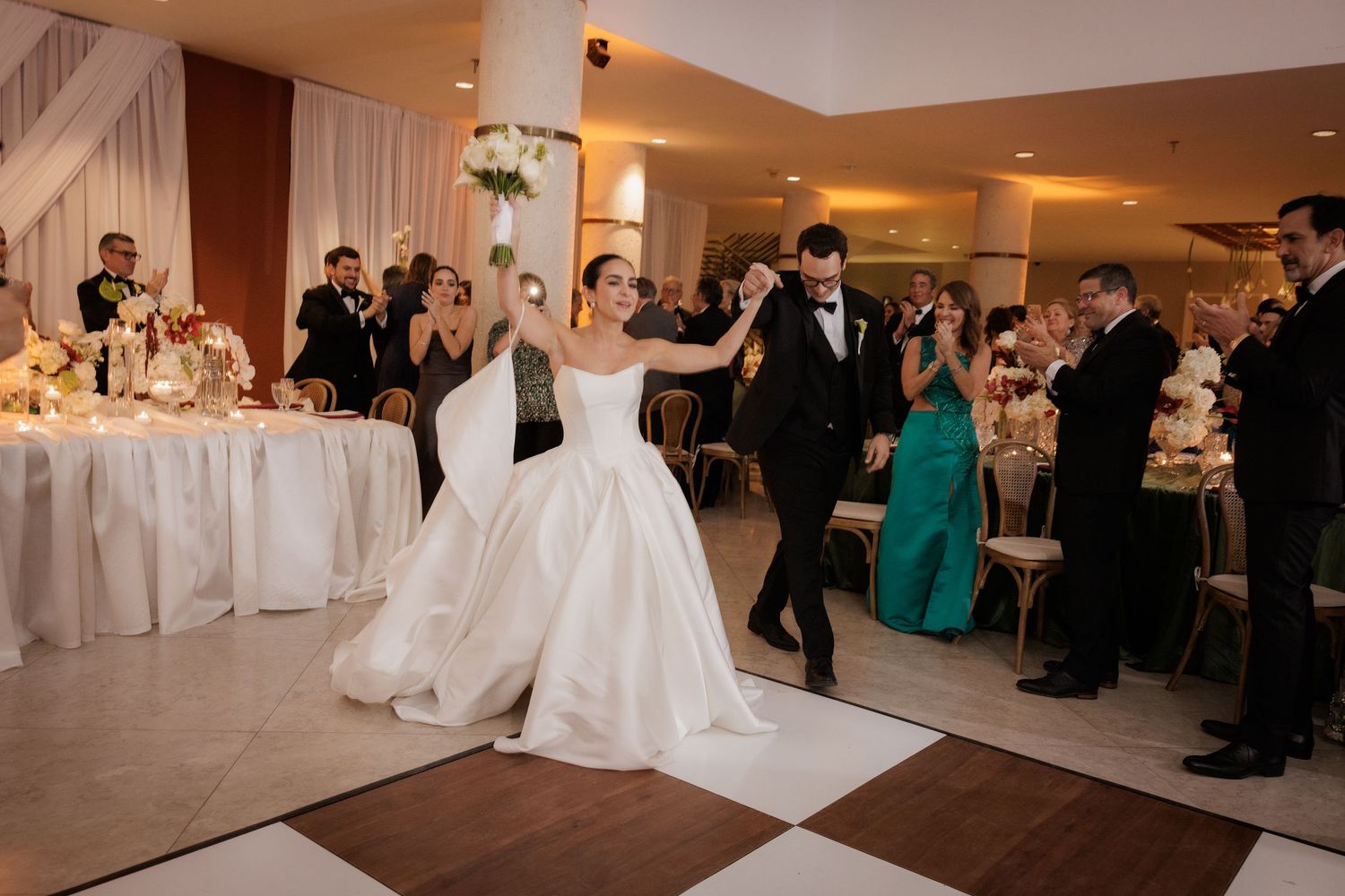 A wedding reception sequence showing dancing, dining, and celebration in an elegant banquet hall.