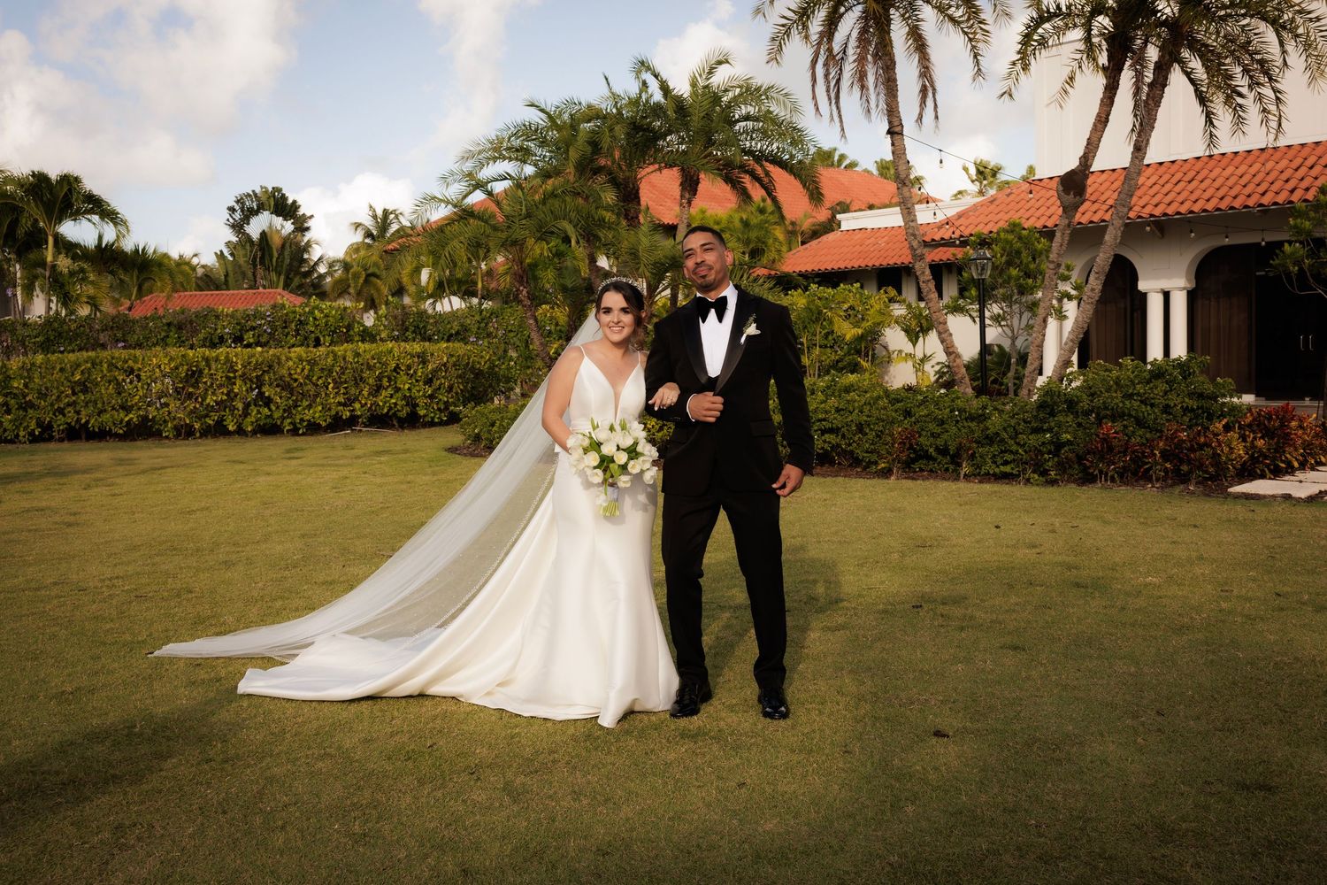 A romantic wedding photo sequence showing two figures walking hand in hand through a lush garden setting at sunset.