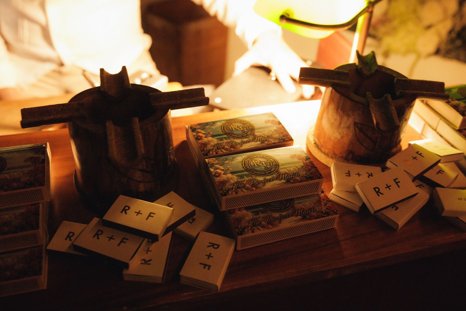 Sequence of images showing lit candles and tarot cards laid out on a dark wooden surface in ambient lighting.