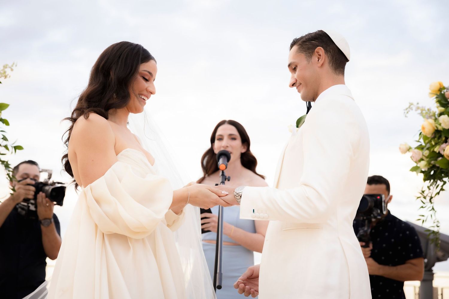 Wedding couple shares intimate moments in outdoor setting with natural lighting.