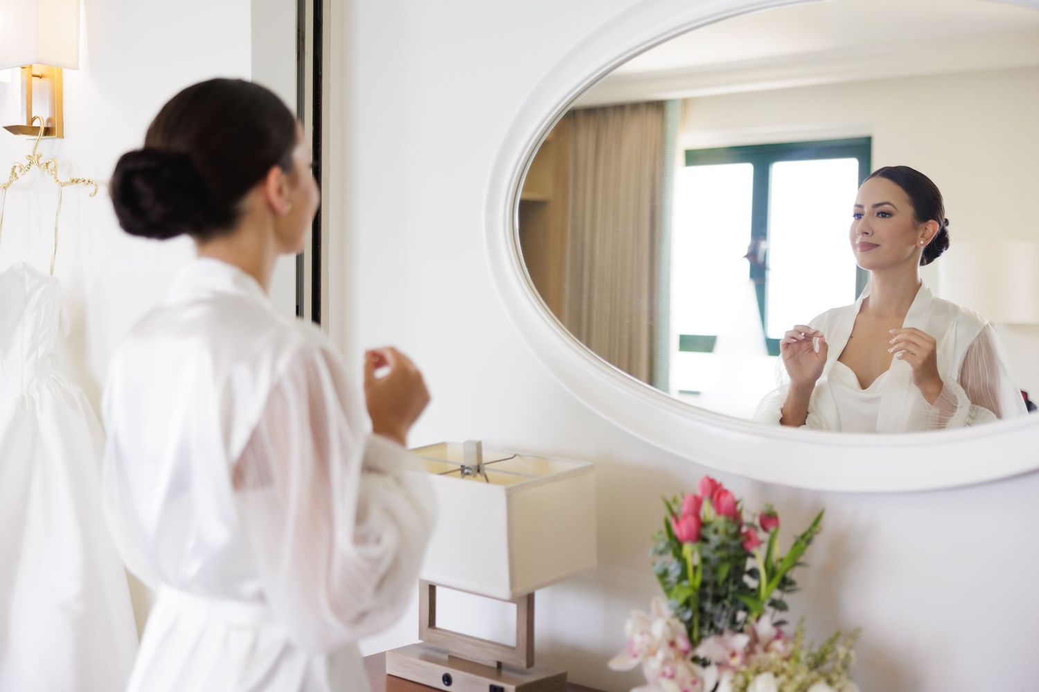 Series of getting ready shots showing bride in white robe preparing for wedding day in sunlit room.