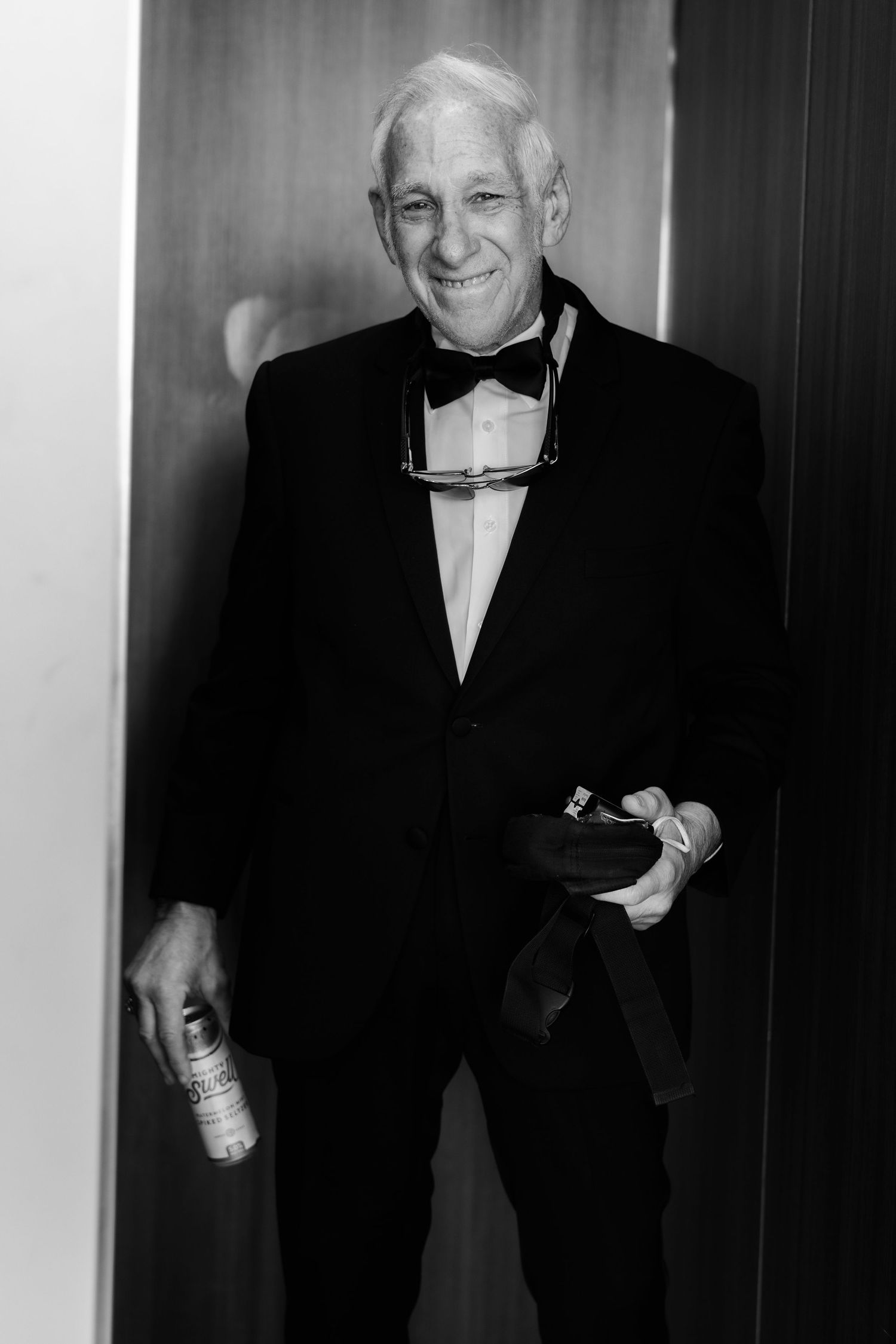 Series of black and white formal portraits showing laughter and smiles in elegant attire.