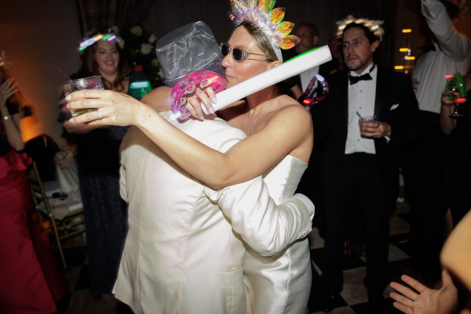 A series of candid wedding reception photos showing couples dancing and embracing on the dance floor.
