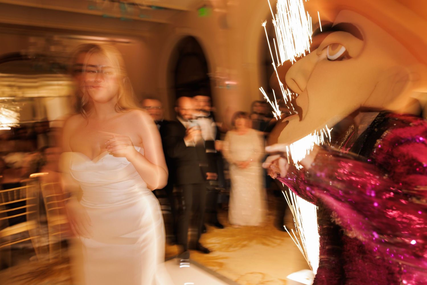 Motion-blurred dance floor shots capturing the energy and movement at a wedding reception.