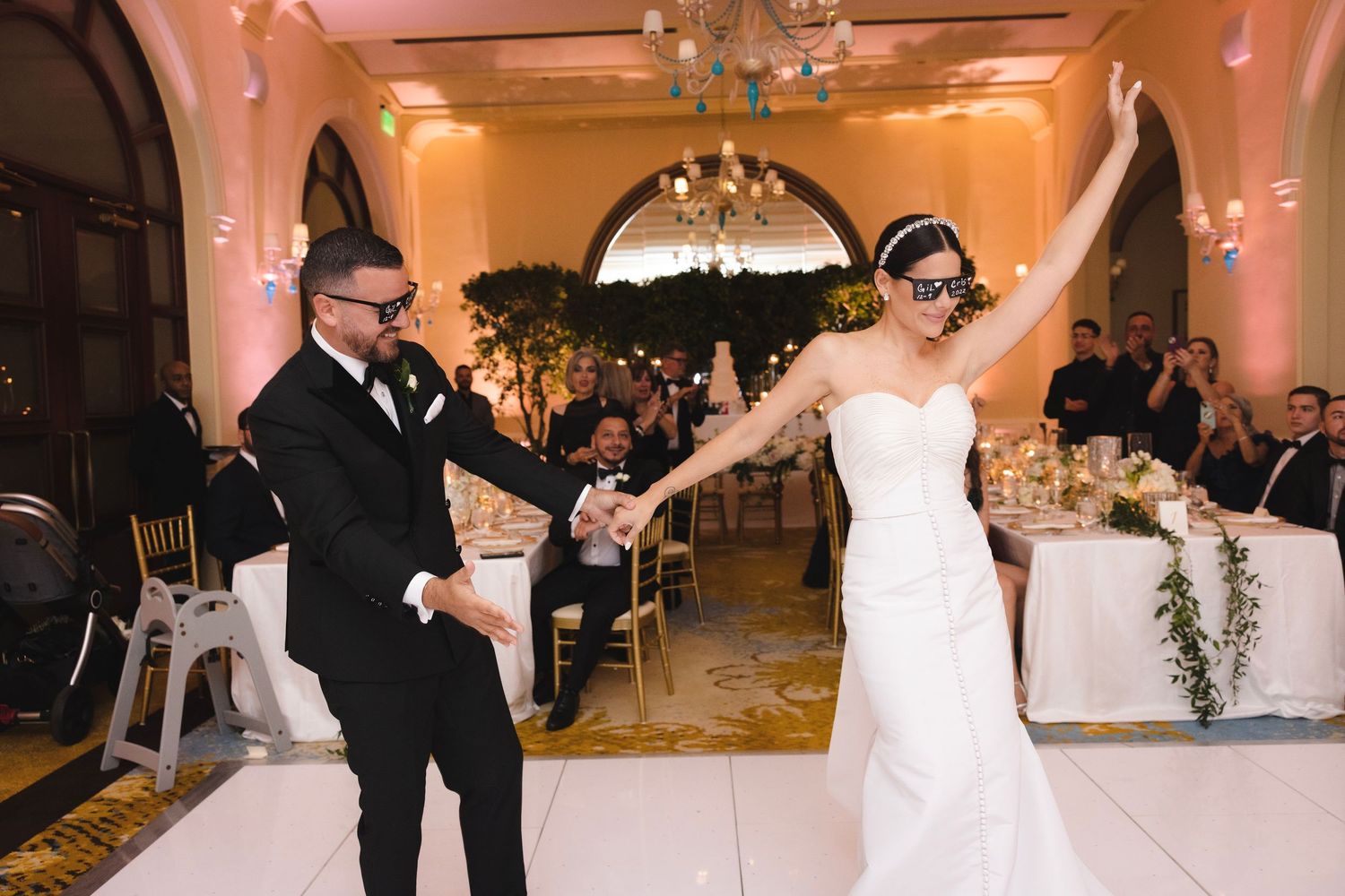 A series of wedding reception photos show dance floor moments with guests in formal attire celebrating at an elegant venue.