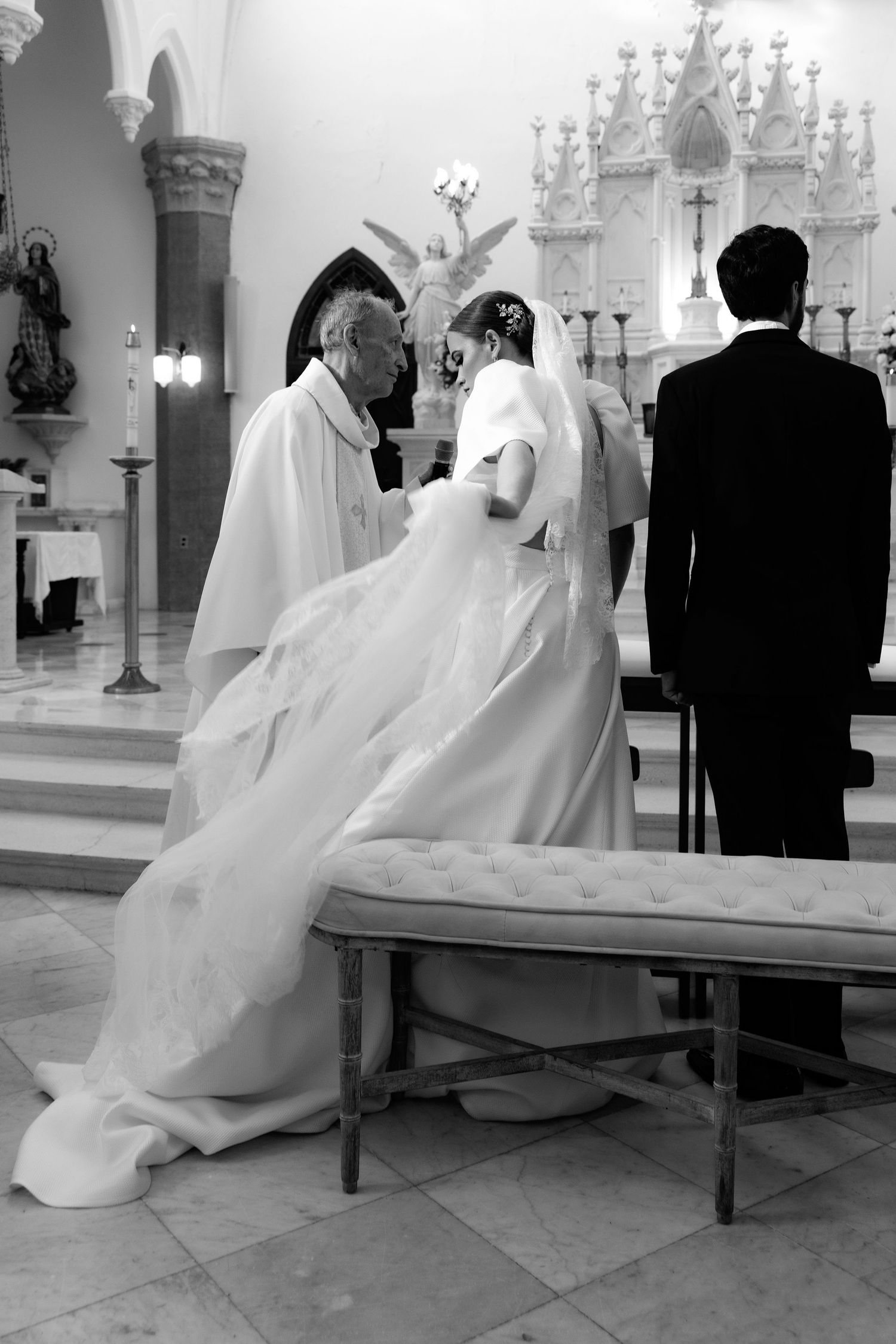 Black and white photographs showing a traditional church wedding ceremony from various dramatic angles.
