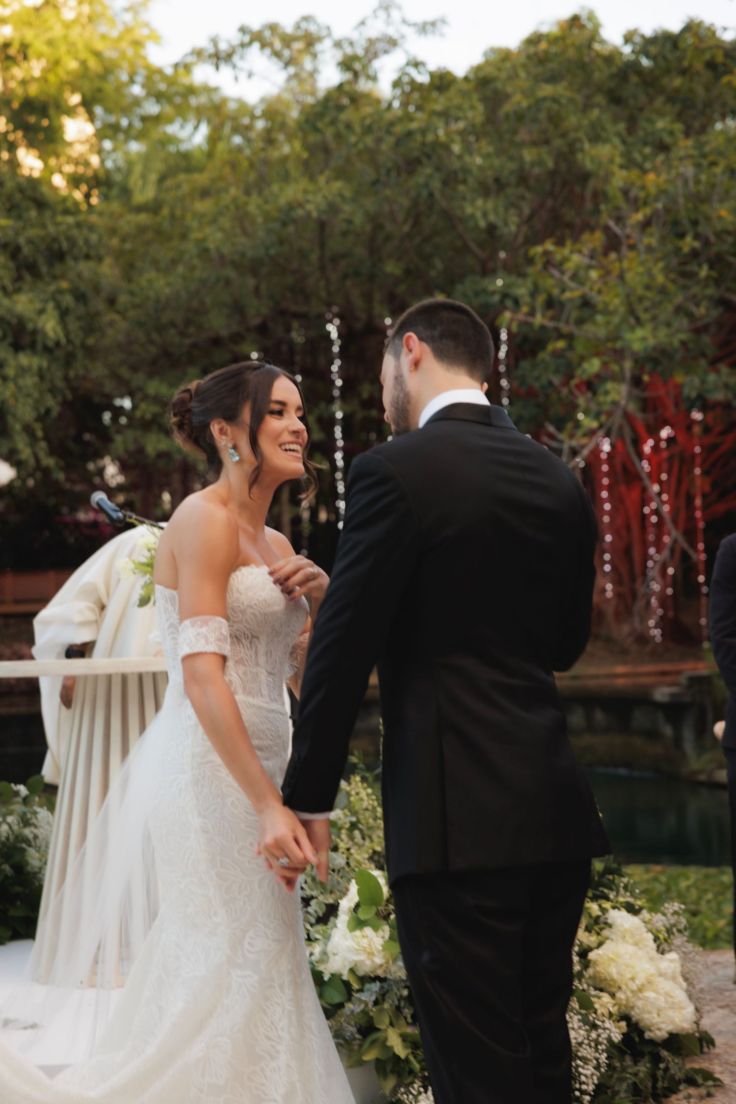 Candid sequence of newlyweds sharing a joyful moment during their outdoor wedding celebration.