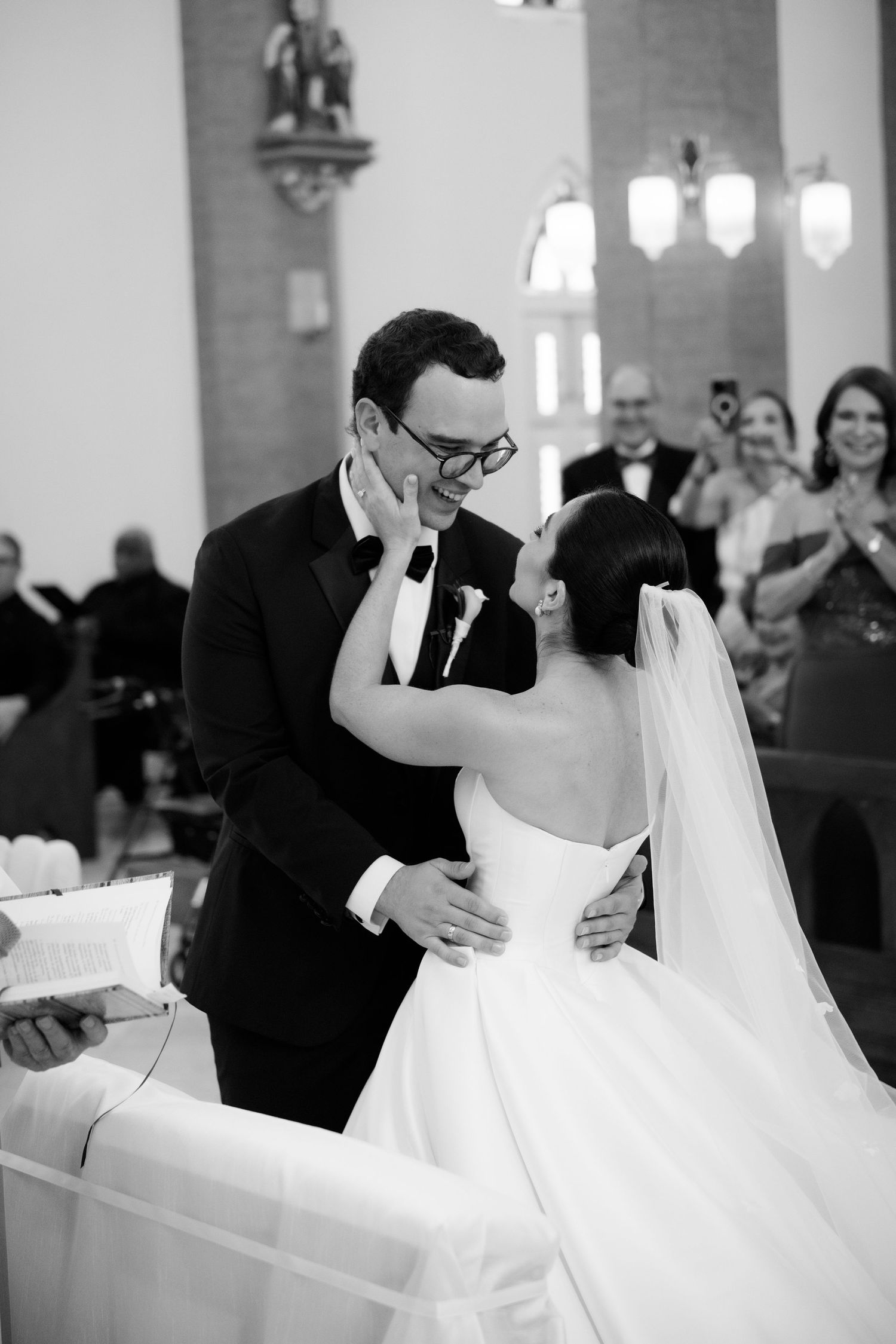Wedding couple sharing an intimate moment during their first dance in a church.