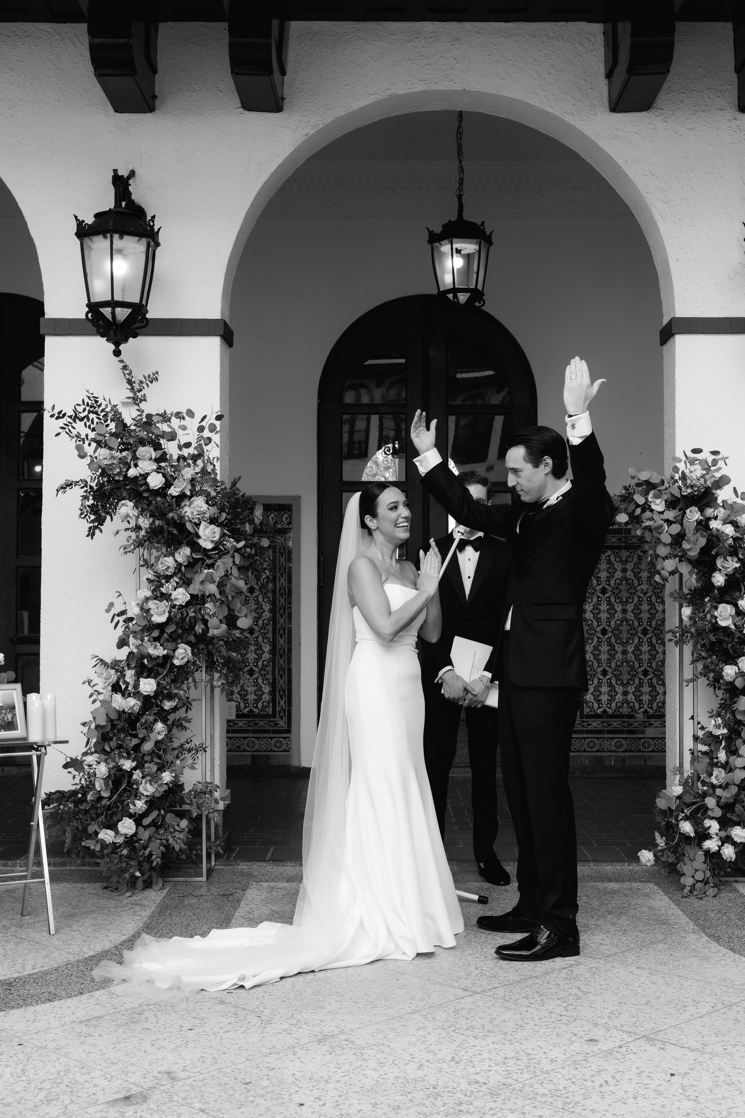 A wedding series sequence showing a couple sharing joyful moments under white arched walkways with floral decorations.