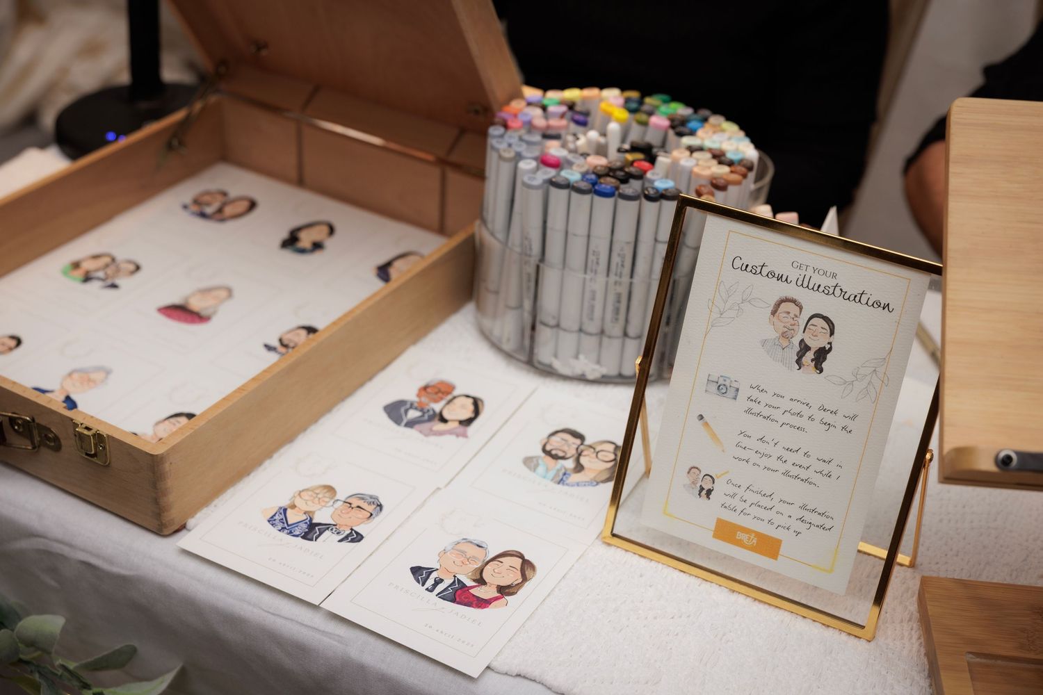 A collection of various wedding invitations and cartoon illustrations arranged in a grid on a wooden surface.