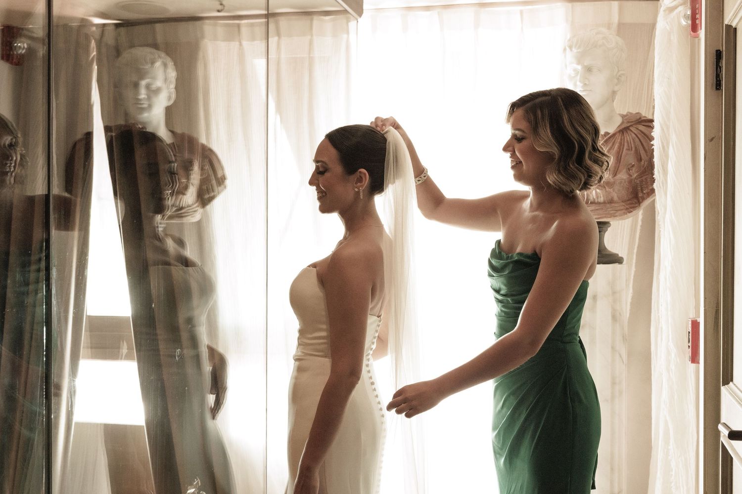 A serene bridal preparation scene captured in soft natural light streaming through sheer curtains.
