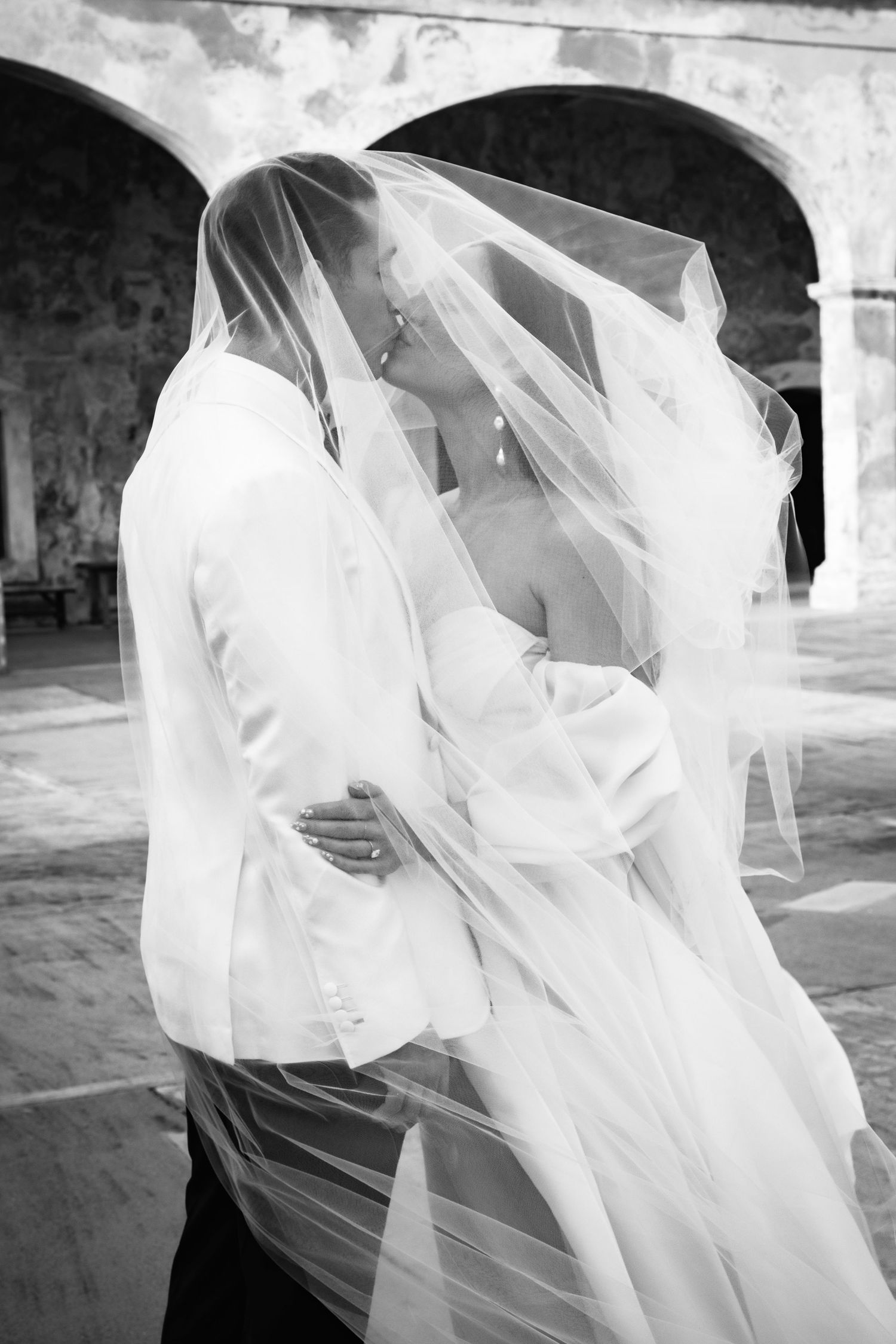 Artistic black and white sequence of billowing wedding veil movements.