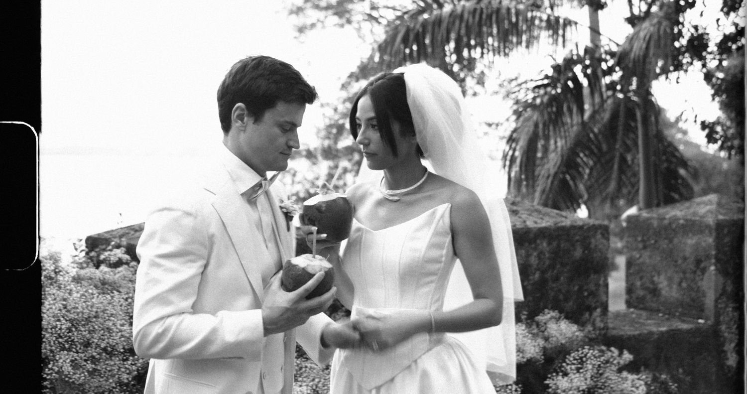 Five black and white images showing romantic moments in an outdoor garden setting.