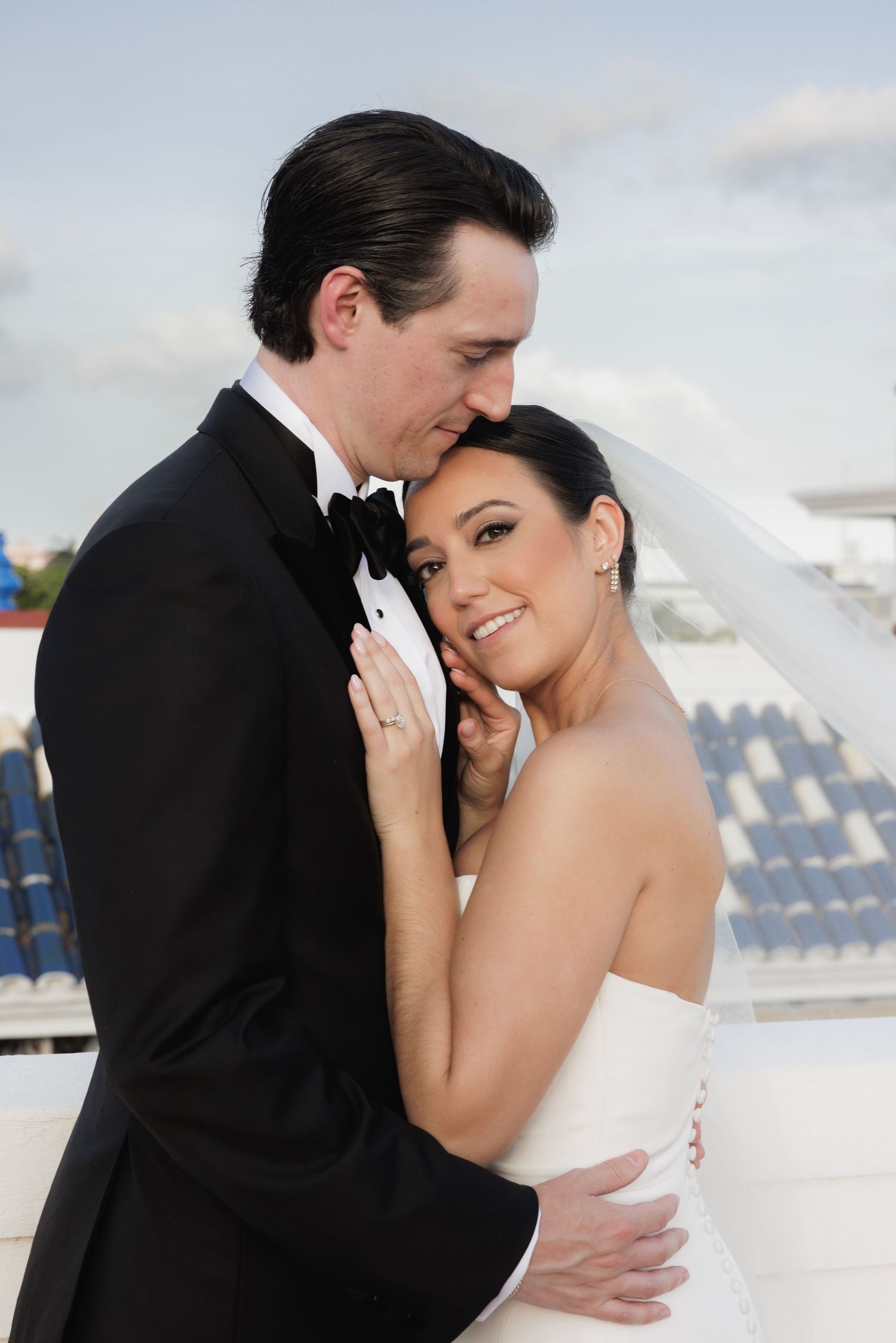 A romantic series of wedding photos showing intimate moments between a bride and groom in formal attire against a snowy backdrop.
