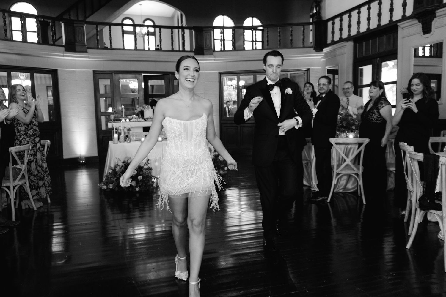 A sequence of black and white wedding photos showing dancing and celebration moments in an elegant banquet hall.