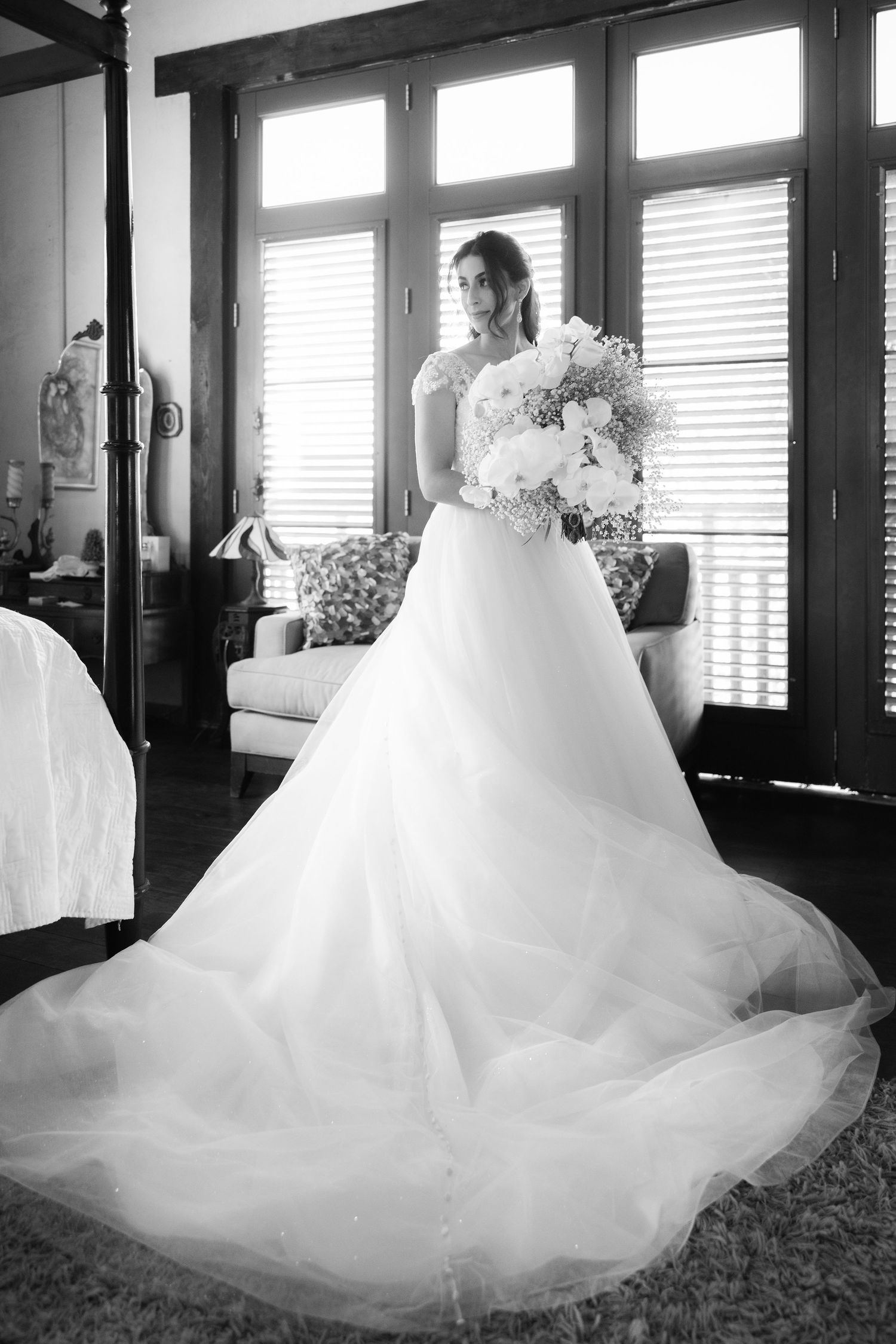 Ethereal wedding dress swirls in graceful movement across multiple black and white frames.
