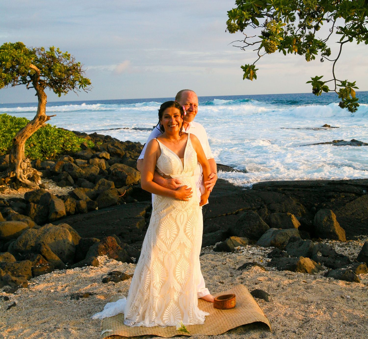 Newly married couple at Old Airport Beach Kona Hawaii celebrating elopement ceremony at sunset