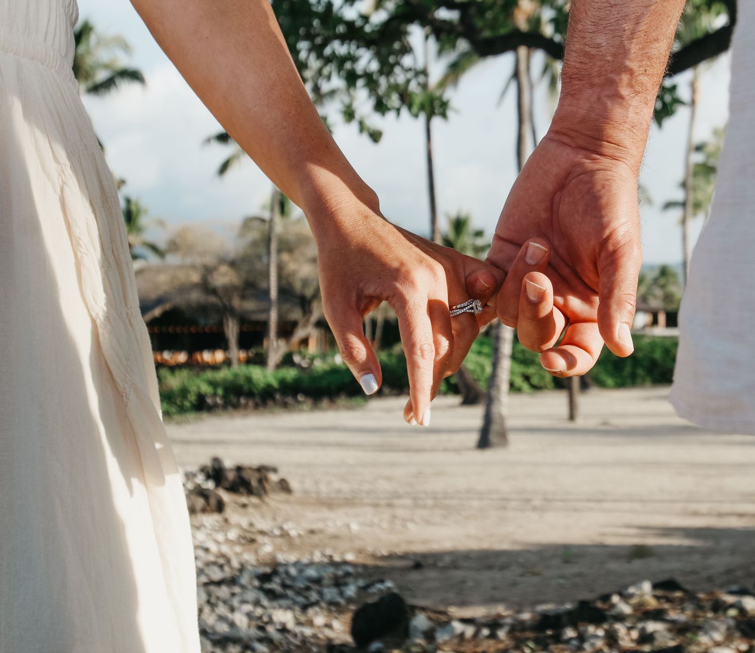 Sunset proposal setup with red roses and beach scenery Hawaii