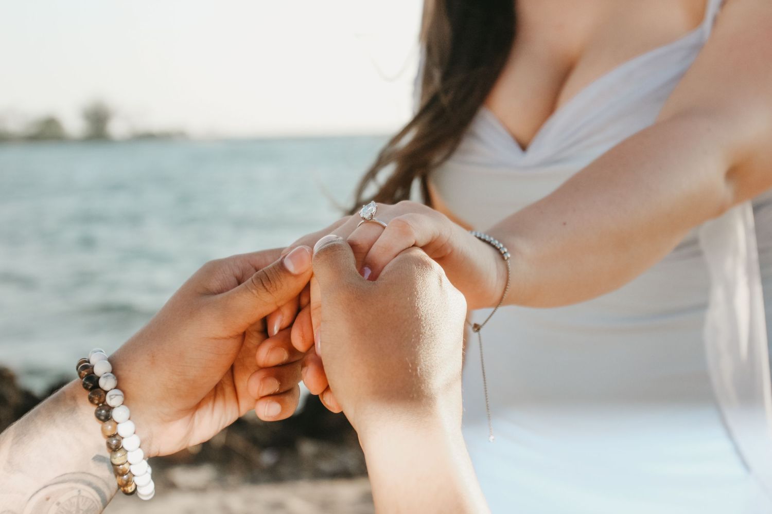 Kukio Beach sunset engagement ring close-up hands Big Island Hawaii photographer