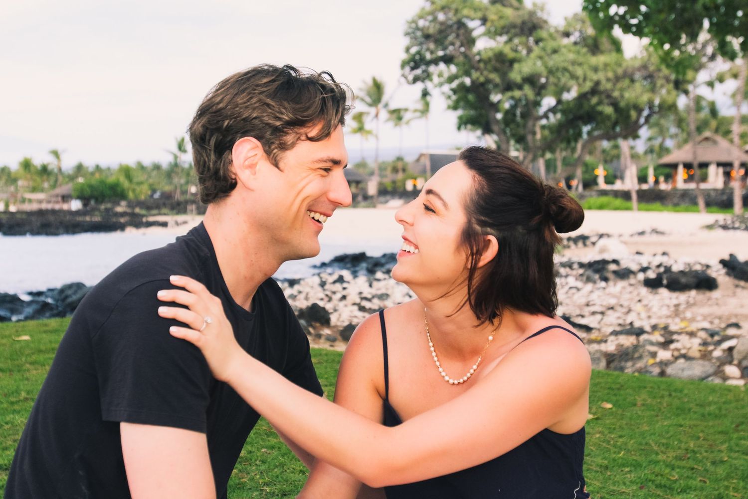Couple reacting after proposal on Big Island Hawaii beach