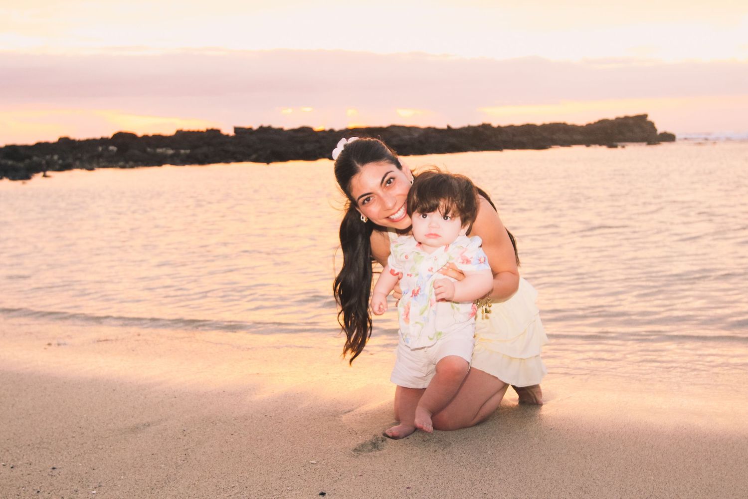 Sunset beach session mom and toddler near shoreline Big Island Hawaii photographer