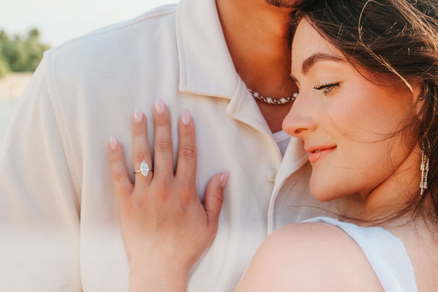Kukio Beach sunset engagement hug showing ring Big Island Hawaii photographer