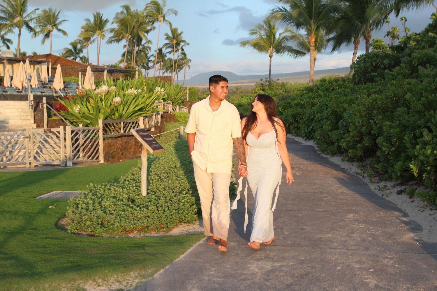 Surprise engagement moment with ocean backdrop Big Island Hawaii