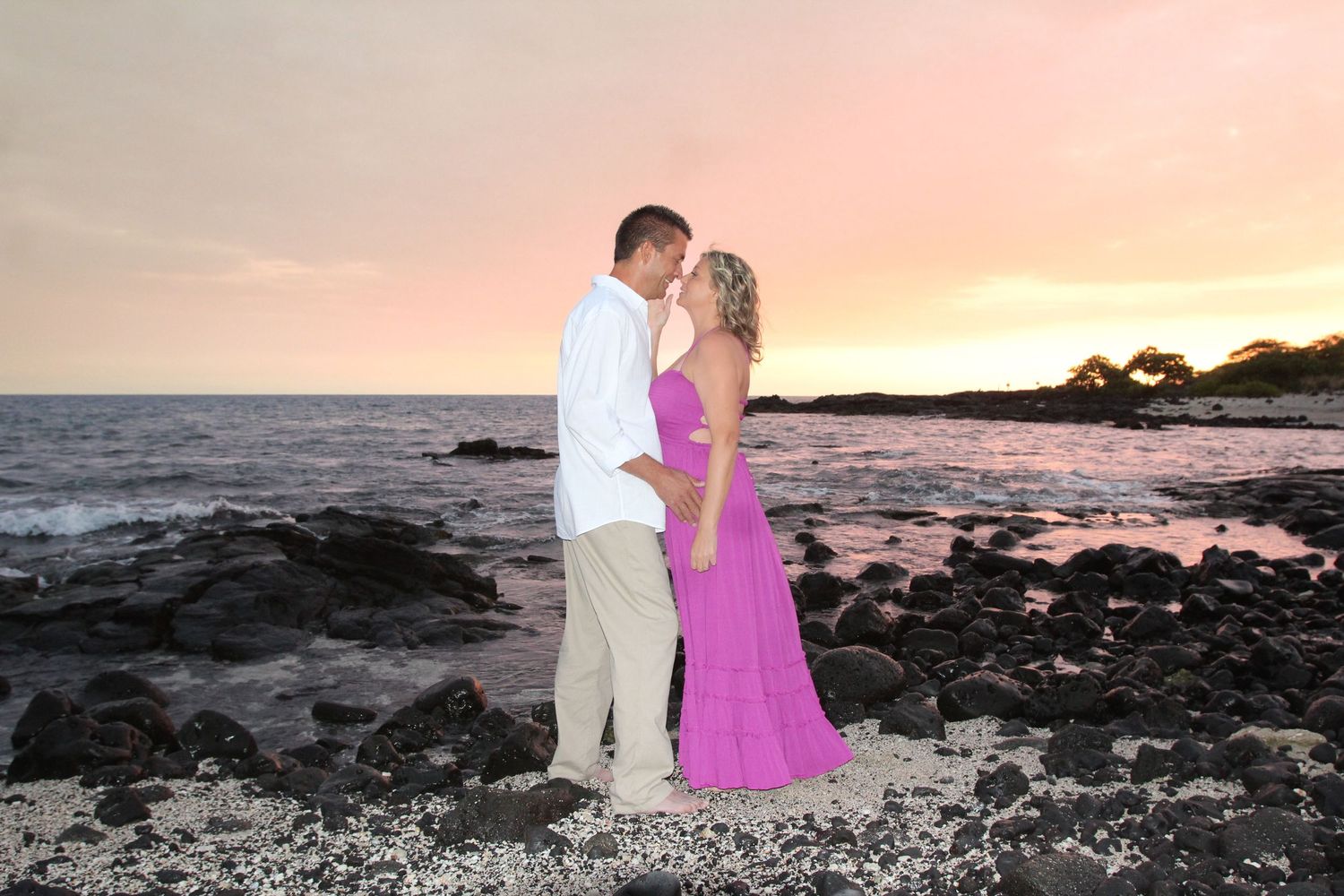 Vow renewal sunset ceremony on rocky coastline Big Island Hawaii photographer