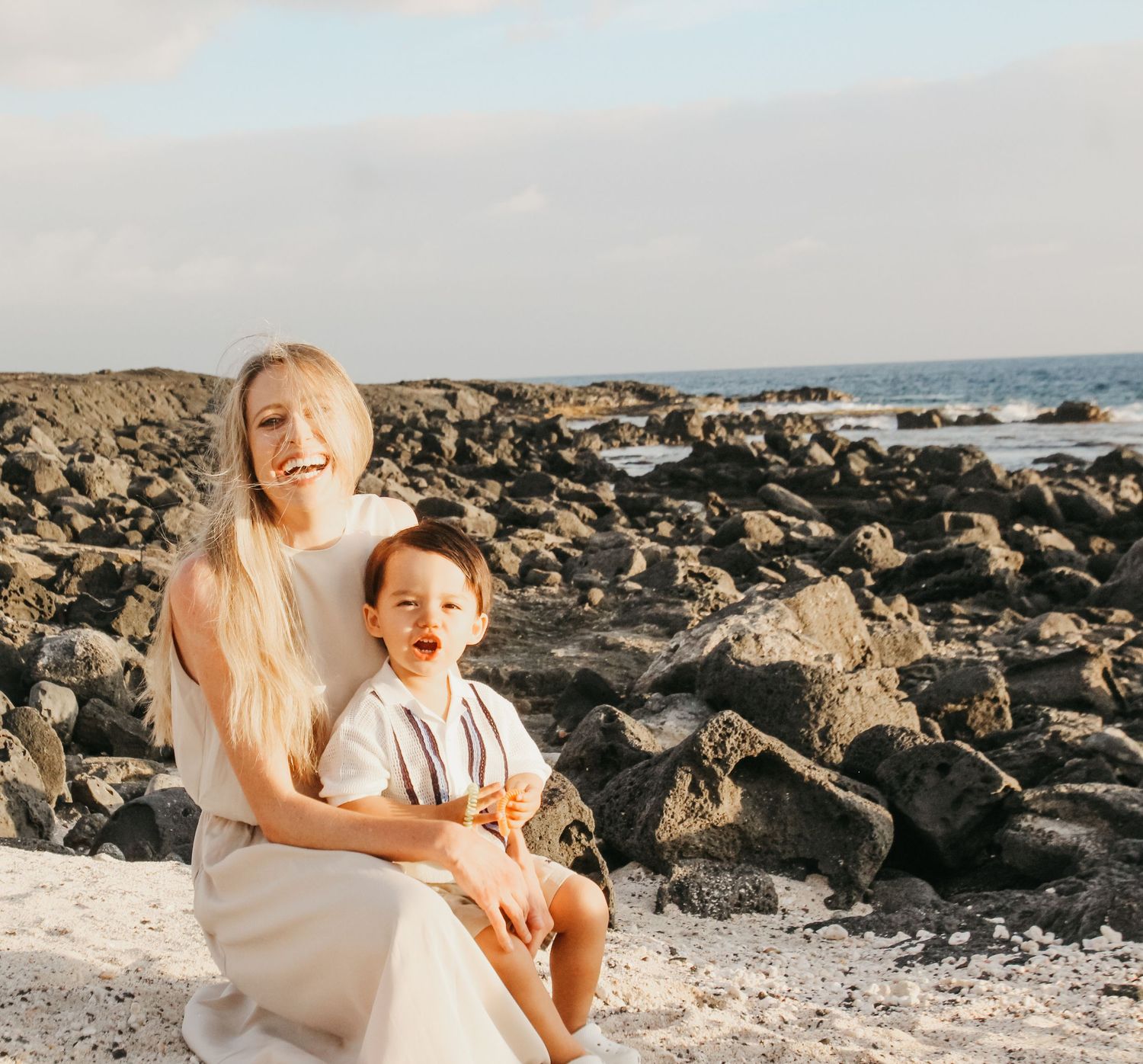 Sunset family session of mother and son on beach in Kona Hawaii