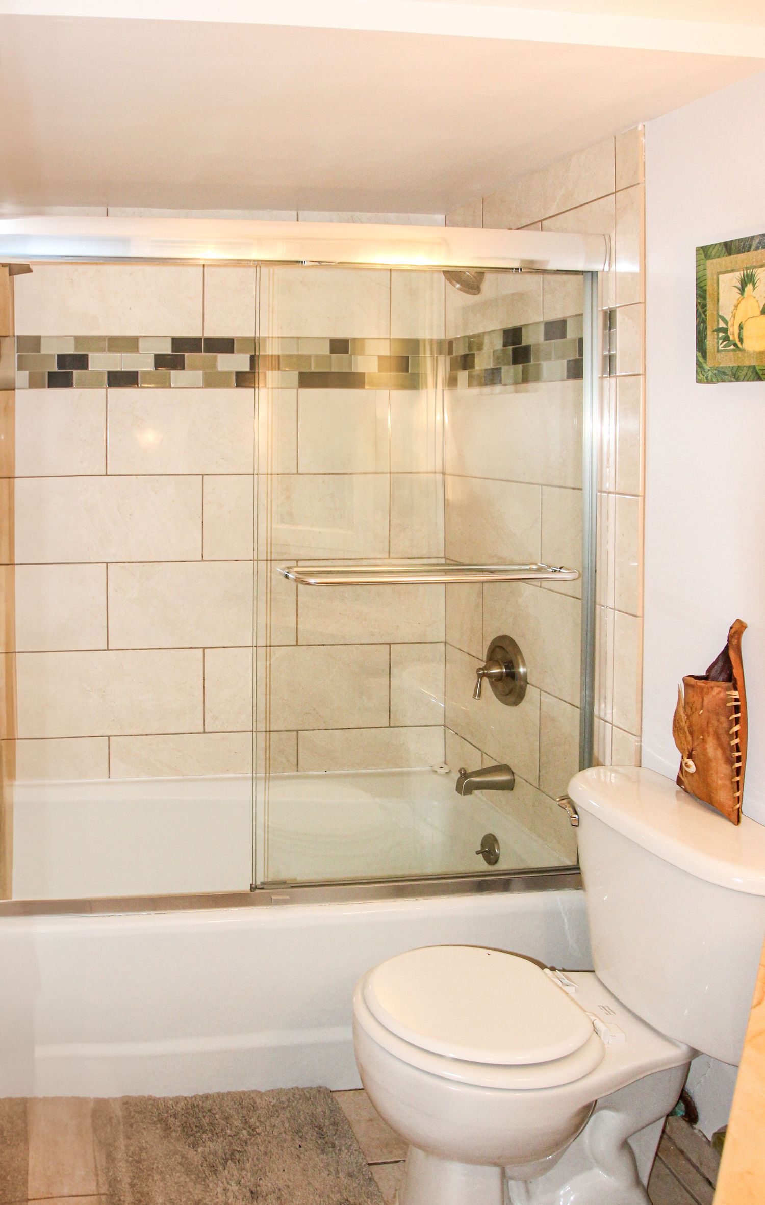 Bathroom detail of older Airbnb property in Hawaii with clean design