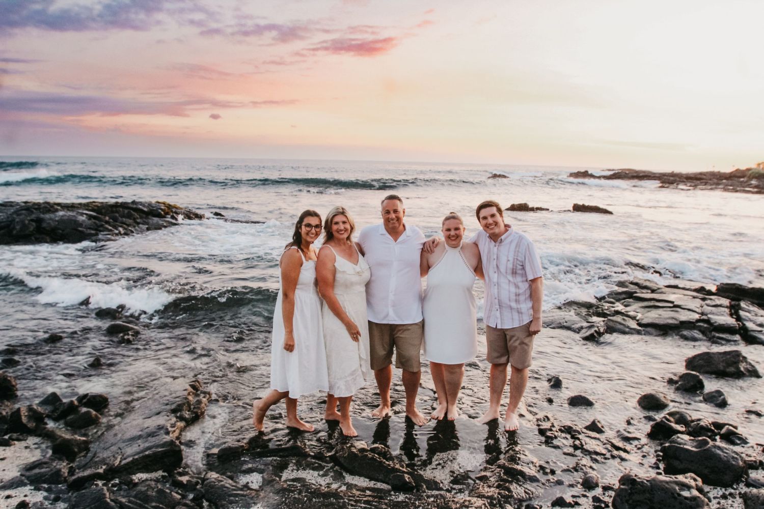 Extended family sunset session with adult children and partners Big Island Hawaii photographer