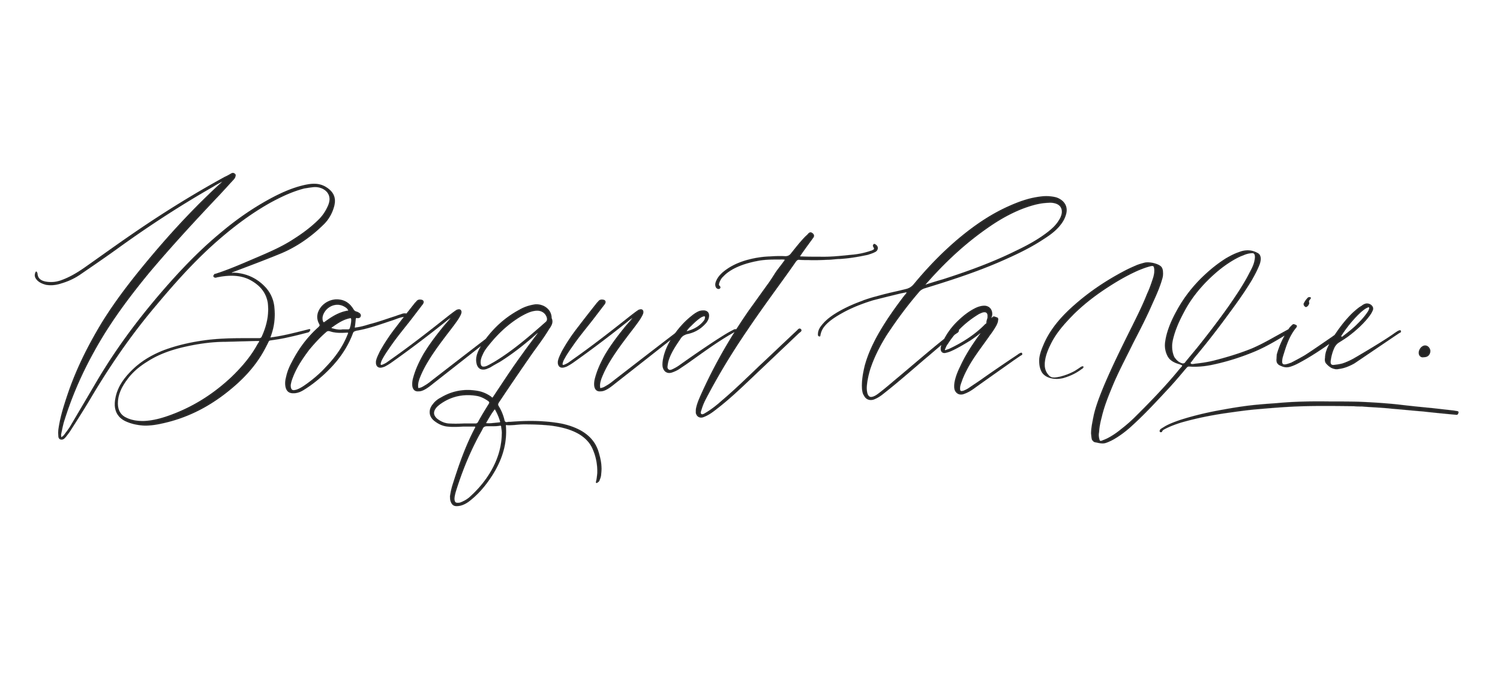 Bouquet la Vie elegant cursive script logo in black on white background for wedding floral design business.