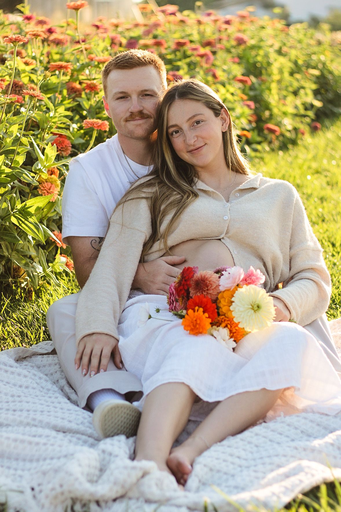 Alexis and Kaden's maternity shoot at a flower farm in Layton, UT.