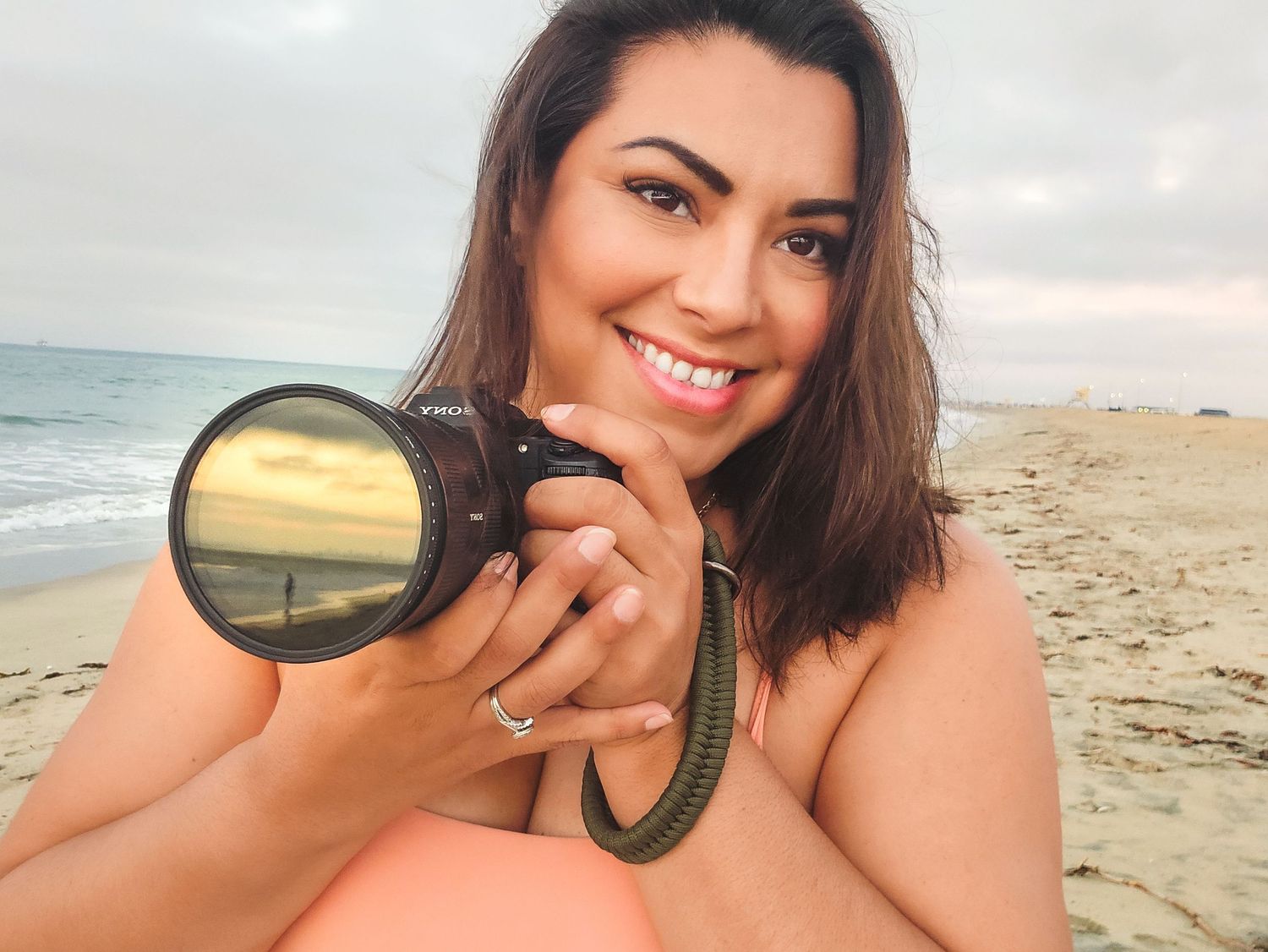 Playful selfies taken at sunset on a beach with sunglasses.